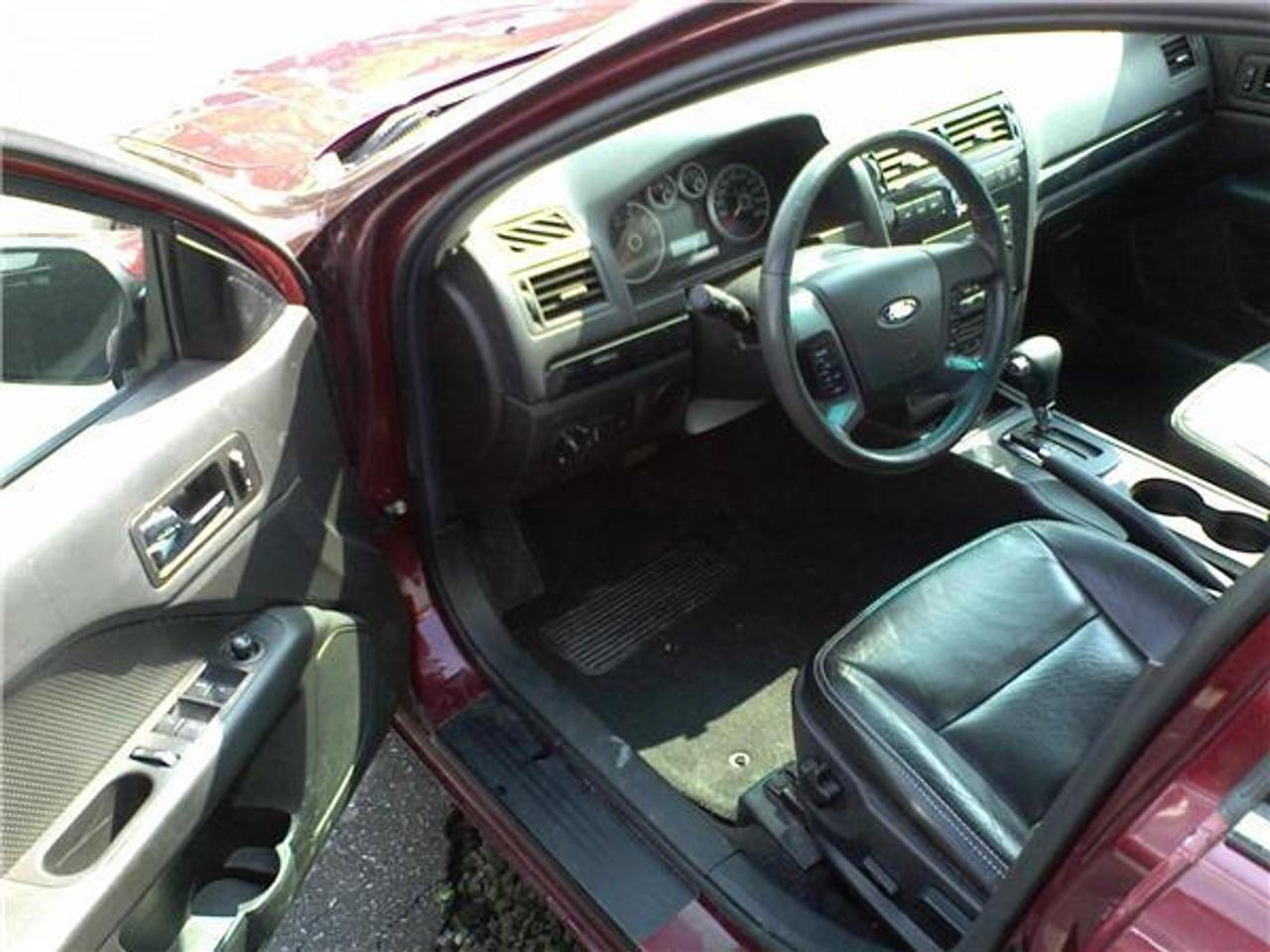 heated mirrors,heated seats,piano black trim,steering wheel audio,dual zone auto climate control,in-dash clock