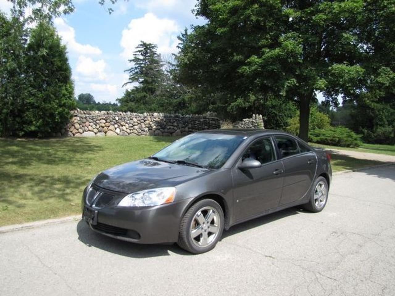 This 2007 Pontiac G6 4dr GT SUNROOF!! SPOILER!! CHROME!! GM LEASE RETURN!! Sedan features a 3.5L V6 SFI 6 cyl Gasoline engine. It is equipped with a Automatic transmission. The vehicle is Grey with a CHARCOAL GREY Cloth interior. It is offered with the remaining factory warranty. Over 400 BETTER used cars in stock!! PLEASE CALL 1-866-348-8146 5.99% Financing + no payments up to 6 months available on approved credit!! Free Trial Exchange!! A+ Better Business Bureau rating!! Voted Guelphs Favourite dealer 2004-2009!! Since 1961. Taxes, licensing, and $5.00 OMVIC fee are extra. Call for details on our Free Trial Exchange! Thank you for considering Wilsons!!! Please call 1-866-348-8146. - This Pontiac is in Excellent overall exterior condition, Excellent overall interior condition, Cloth seats - Air Conditioning, Cruise Control, Power Steering, Power Windows, Power Door Locks, Power Mirrors, Tilt Steering Wheel, Steering Wheel Radio Controls, Sunroof, Driver Airbag, Passenger Airbag, Keyless Entry, ABS Brakes, Rear Defogger, Intermittent Wipers, AM-FM, CD Player, Chrome Wheels, Cloth Interior Surface, Rear Spoiler, Rear Spoiler - Contact The Internet Department at 866-738-6045 or leads@markwilsonsbetterusedcarstc.dealer.com for more information. -