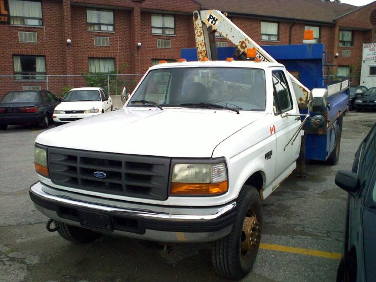 1996 Ford F450 Dump Truck - 7.3 L turbo diesel, Auto. transmission, p/s, p/b, am/fm stereo. Dump box size 10 by 7.5, comes with tarp, tailgate of dump opens on rear and on sides. Crane is PM Serie 3 brand with 990 kg P.TA.  Pintle and ball mount hitch. New tires all around. All equipment works and truck runs well. One owner truck.