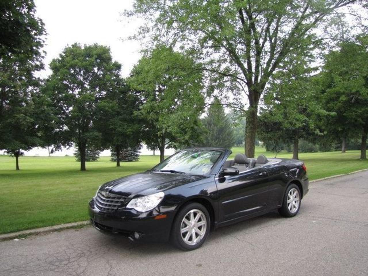 This 2008 Chrysler Sebring 2dr Jim TOURING !!! LEATHER!!! NEW TIRES!! EIGHTEENS!! Convertible features a 2.7L V6 MPI SOHC 12V 6 cyl Gasoline engine. It is equipped with a Automatic transmission. The vehicle is Black with a Grey Leather interior. It is offered with the remaining factory warranty. Over 400 BETTER used cars in stock!! PLEASE CALL 1-866-348-8146 5.99% Financing + no payments up to 6 months available on approved credit!! Free Trial Exchange!! A+ Better Business Bureau rating!! Voted Guelphs Favourite dealer 2004-2009!! Since 1961. Taxes, licensing, and $5.00 OMVIC fee are extra. Call for details on our Free Trial Exchange! Thank you for considering Wilsons!!! Please call 1-866-348-8146. - This Chrysler is in Excellent overall exterior condition, Excellent overall interior condition, Leather seats - Air Conditioning, Climate Control, Cruise Control, Power Steering, Power Windows, Power Door Locks, Power Mirrors, Leather Steering Wheel, Power Drivers Seat, Heated Seat, Clock, Tachometer, Digital Info Center, Tilt Steering Wheel, Steering Wheel Radio Controls, Passenger Airbag, Keyless Entry, ABS Brakes, Rear Defogger, Intermittent Wipers, AM-FM, CD Player, Aluminum Wheels, Leather Interior Surface, Aux. Audio Input - Contact The Internet Department at 866-738-6045 or leads@markwilsonsbetterusedcarstc.dealer.com for more information. -