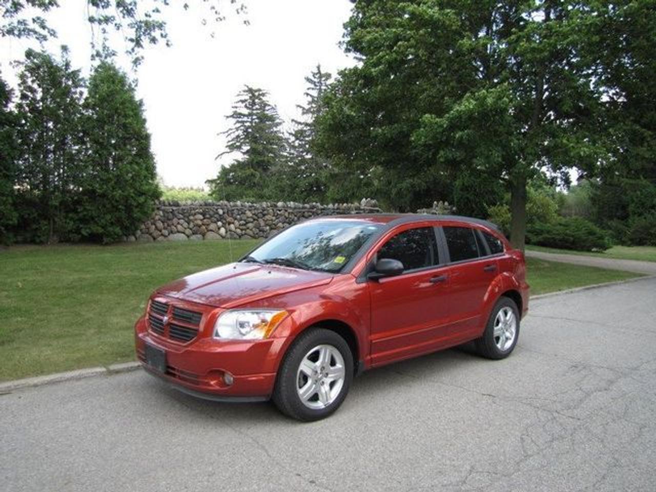 This 2007 Dodge Caliber 4dr SXT PREMIUM PKG!! SUNROOF!!! CHRYSLER LEASE RETURN!! Sedan features a 2.0L L4 DOHC 16V 4 cyl Gasoline engine. It is equipped with a Automatic transmission. The vehicle is SUNBURST ORANGE with a PASTEL SLATE GREY Cloth interior. It is offered with the remaining factory warranty. Over 400 BETTER used cars in stock!! PLEASE CALL 1-866-348-8146 5.99% Financing + no payments up to 6 months available on approved credit!! Free Trial Exchange!! A+ Better Business Bureau rating!! Voted Guelphs Favourite dealer 2004-2009!! Since 1961. Taxes, licensing, and $5.00 OMVIC fee are extra. Call for details on our Free Trial Exchange! Thank you for considering Wilsons!!! Please call 1-866-348-8146. - This Dodge is in Excellent overall exterior condition, Excellent overall interior condition, Cloth seats - Air Conditioning, Cruise Control, Power Steering, Power Windows, Power Door Locks, Power Mirrors, Clock, Tilt Steering Wheel, Sunroof, Driver Airbag, Passenger Airbag, Keyless Entry, ABS Brakes, Rear Defogger, Intermittent Wipers, AM-FM, CD Player, CD Changer, Alloy Wheels, Cloth Interior Surface, Rear Spoiler, Rear Spoiler - Contact The Internet Department at 866-738-6045 or leads@markwilsonsbetterusedcarstc.dealer.com for more information. -