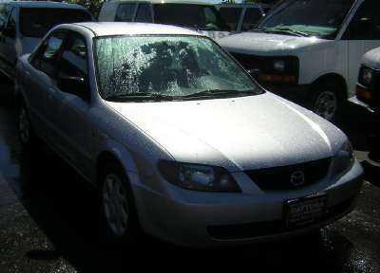 - Engine: 2.0 Liter
2003 Mazda Protg LX 2.0L auto power locks tilt cc 
cd a/c key less excellent condition, only 157000km, 
financing available to view our inventory or apply on line 
please visit www.daytonaauto.netor call 604-263-2222