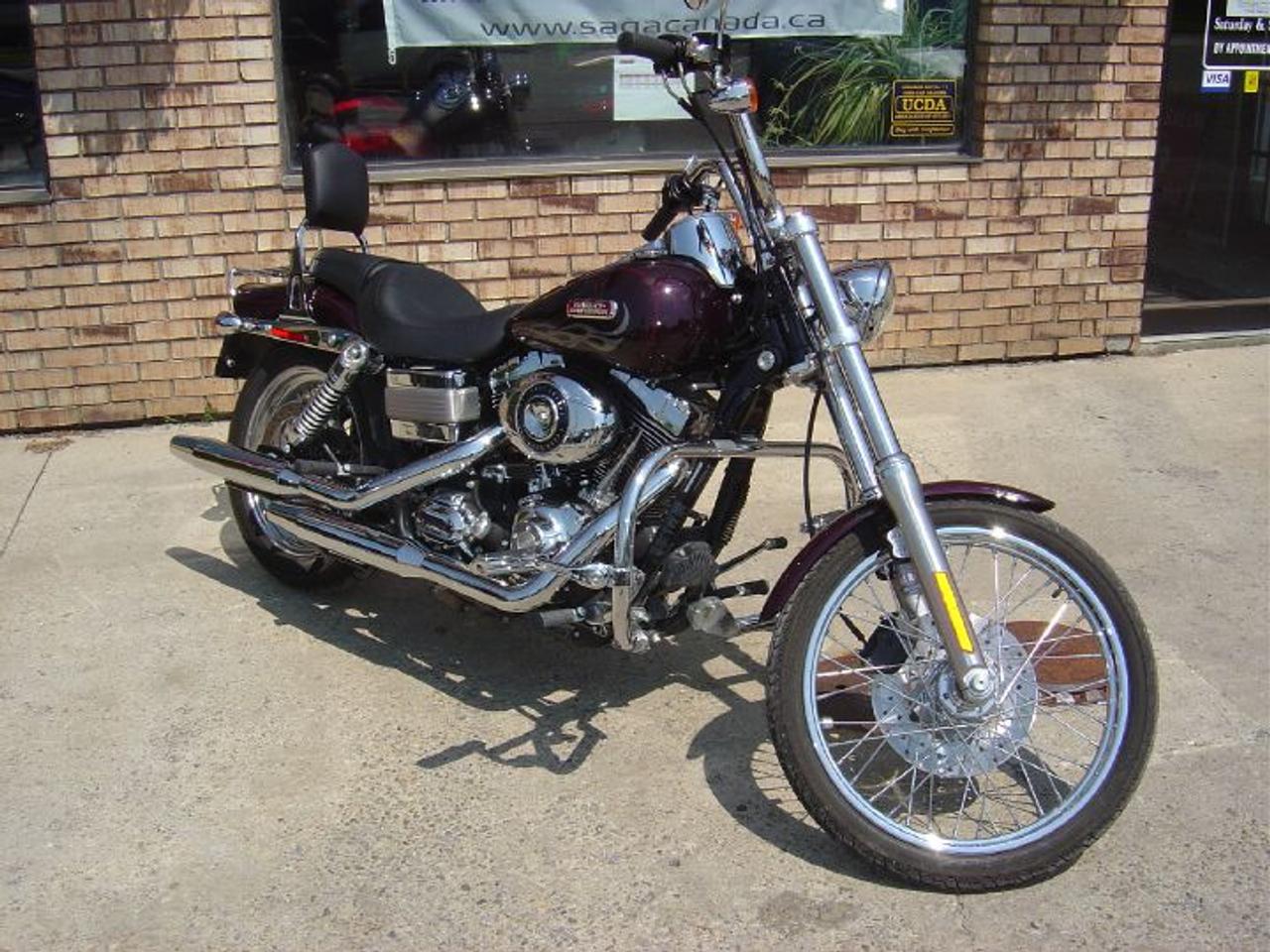 END OF SUMMER BLOWOUT! WAS $15,990! Harley Dyna Wide Glide! 96 cubic inches, 6 speed, keyless ignition and a sweet exhaust note. This bike is absolutely mint and priced to sell!! 550KM is not a misprint.  Chrome galore, never been dropped, never rain ridden, always stored in indoor heated shop. Still months of riding left! Get it before its gone!