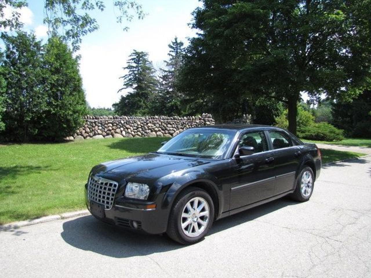 This 2007 Chrysler 300 4dr TOURING!! LEATHER!! ROOF!! CHROME!! Sedan features a 3.5L V6 MPI 6 cyl Gasoline engine. It is equipped with a Automatic transmission. The vehicle is Black with a Grey Leather interior. Over 400 BETTER used cars in stock!! PLEASE CALL 1-866-348-8146 5.99% Financing + no payments up to 6 months available on approved credit!! Free Trial Exchange!! A+ Better Business Bureau rating!! Voted Guelphs Favourite dealer 2004-2009!! Since 1961. Taxes, licensing, and $5.00 OMVIC fee are extra. Call for details on our Free Trial Exchange! Thank you for considering Wilsons!!! Please call 1-866-348-8146. - This Chrysler is in Excellent overall exterior condition, Excellent overall interior condition, Leather seats - Air Conditioning, Climate Control, Dual Zone Climate Control, Cruise Control, Power Steering, Power Windows, Power Door Locks, Power Mirrors, Leather Steering Wheel, Power Drivers Seat, Power Passenger Seat, Heated Seat, Wood Trim, Clock, Tachometer, Digital Info Center, Homelink System, Tilt Steering Wheel, Telescoping Steering Wheel, Sunroof, Driver Airbag, Passenger Airbag, Keyless Entry, ABS Brakes, Traction Control, Rear Defogger, Intermittent Wipers, AM-FM, CD Player, Chrome Wheels, Leather Interior Surface, Power Adjustable Pedals - Contact The Internet Department at 866-738-6045 or leads@markwilsonsbetterusedcarstc.dealer.com for more information. -