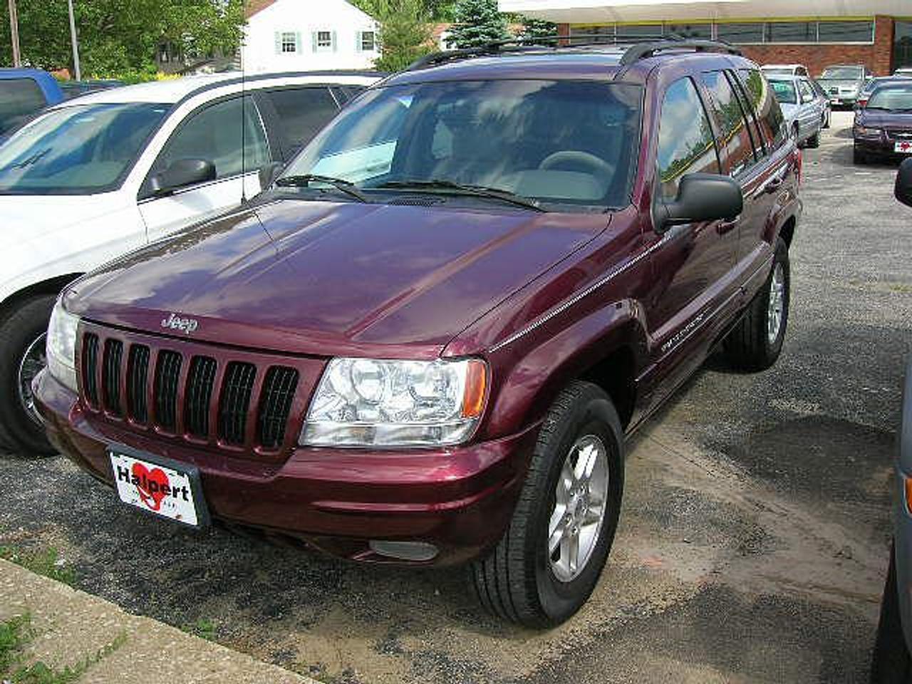 1999 Jeep Grand Cherokee Limited - 4x4! Certified / E-test! 
Burgandy on black leather interior, 4.7L, V8, 4 door, 4x4, loaded with keyless, power windows, power door locks, power steering, tilt, cruise, power sunroof, heated seats, dual air bags, power seats, folding rear seats, privacy glass, roof rack. Runs great! Has a few dents on the body but no rust. Selling for $4,395.00 Certified / E-tested! Please call: 905-567-0200