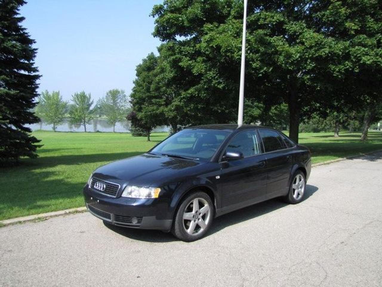 This 2003 Audi A4 4dr 1.8T quattro HTD LTHR!! SUNROOF!! AWD Sedan features a 1.8L L4 FI 20V Turbo 4 cyl Gasoline engine. It is equipped with a 5 Speed Manual transmission. The vehicle is Blue with a Black Leather interior. Over 400 Better used cars in stock!! PLEASE CALL 1-866-348-8146 A+ Better Business Bureau rating!! Voted Guelphs Favourite dealer 2004-2009!! Since 1961. Taxes, licensing and $5.00O MVIC fee are extra. WE ARE SELLING THIS ONE "AS IS" and we are required by law to state, even if this vehicle is perfect: &ldquo;Vehicle is not in roadworthy condition, not certified and not e-tested.&rdquo; THIS VEHICLE MAY EVEN HAVE MANUFACTURERS WARRANTY, AND IT MAY BE THE CAR FOR YOU, AT A PRICE YOU CAN AFFORD!!! - This Audi is in Excellent overall exterior condition, Excellent overall interior condition, Leather seats - Air Conditioning, Climate Control, Dual Zone Climate Control, Cruise Control, Power Steering, Power Windows, Power Door Locks, Power Mirrors, Leather Steering Wheel, Power Drivers Seat, Heated Seat, Clock, Tachometer, Digital Info Center, Tilt Steering Wheel, Telescoping Steering Wheel, Sunroof, Driver Airbag, Passenger Airbag, Keyless Entry, ABS Brakes, Traction Control, Rear Defogger, Intermittent Wipers, AM-FM, CD Player, Alloy Wheels, Leather Interior Surface, Aux. Audio Input - Contact The Internet Department at 866-738-6045 or leads@markwilsonsbetterusedcarstc.dealer.com for more information. -