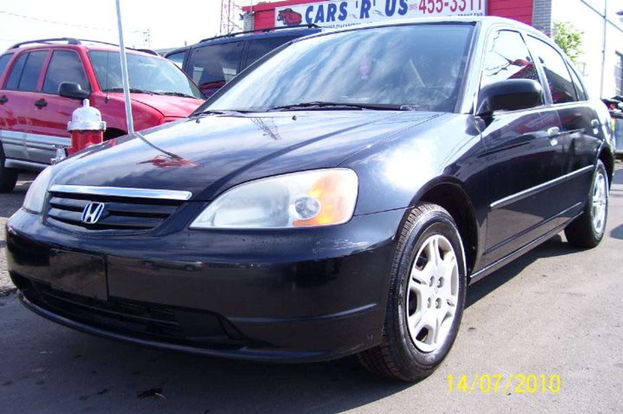 YEAR 01 CIVIC,4 DOOR,AUTO,AC,CD,POWER LOCKS,POWER STEERING,POWER BRAKES,BLACK EXT,BEIGE INT,1 YEAR WARRANTY WITH SAFETY & EMMISON. HST NOT IN.