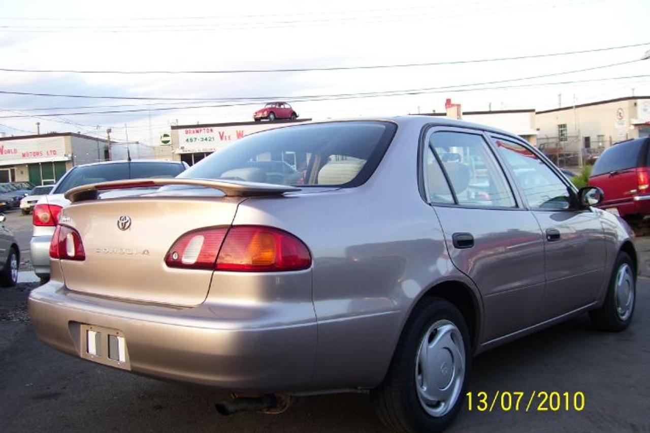YEAR 98 COROLLA,4 DOOR,AUTO,AC,CD,POWER LOCKS,POWER STREEING,POWER BRAKES,BEIGE EXT,BEIGE INT,1 YEAR WARRANTY WITH SAFETY & EMMISON. HST NOT IN.