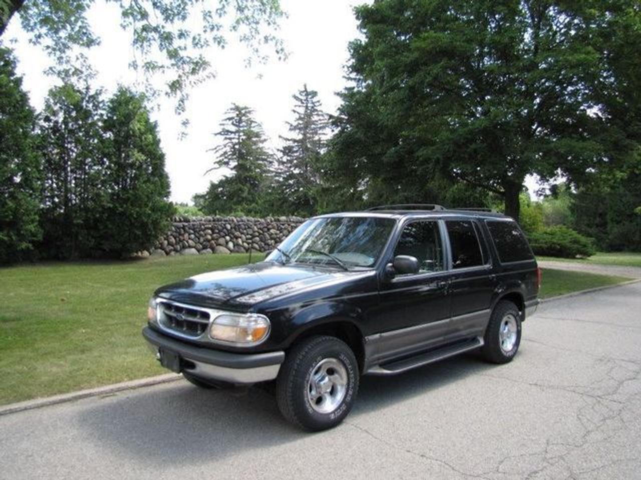 This 1998 Ford Explorer 4dr AS-IS!! LEATHER!! BOARDS!! 4x4 SUV features a 4.0L V6 FI SOHC 6 cyl Gasoline engine. It is equipped with a Automatic transmission. The vehicle is Black with a Grey Leather interior. Over 400 Better used cars in stock!! PLEASE CALL 1-866-348-8146 A+ Better Business Bureau rating!! Voted Guelphs Favourite dealer 2004-2009!! Since 1961. Taxes, licensing and $5.00 OMVIC fee are extra. WE ARE SELLING THIS ONE "AS IS" and we are required by law to state, even if this vehicle is perfect: &ldquo;Vehicle is not in roadworthy condition, not certified and not e-tested.&rdquo; THIS VEHICLE MAY EVEN HAVE MANUFACTURERS WARRANTY, AND IT MAY BE THE CAR FOR YOU, AT A PRICE YOU CAN AFFORD!!! - This Ford is in Excellent overall exterior condition, Excellent overall interior condition, Leather seats - Air Conditioning, Cruise Control, Power Steering, Power Drivers Seat, Tow Package, Roof Rack, Tilt Steering Wheel, Driver Airbag, Passenger Airbag, Keyless Entry, ABS Brakes, Rear Defogger, Intermittent Wipers, AM-FM, CD Player, Alloy Wheels, Leather Interior Surface, Four Wheel Drive - Contact The Internet Department at 866-738-6045 or leads@markwilsonsbetterusedcarstc.dealer.com for more information. -