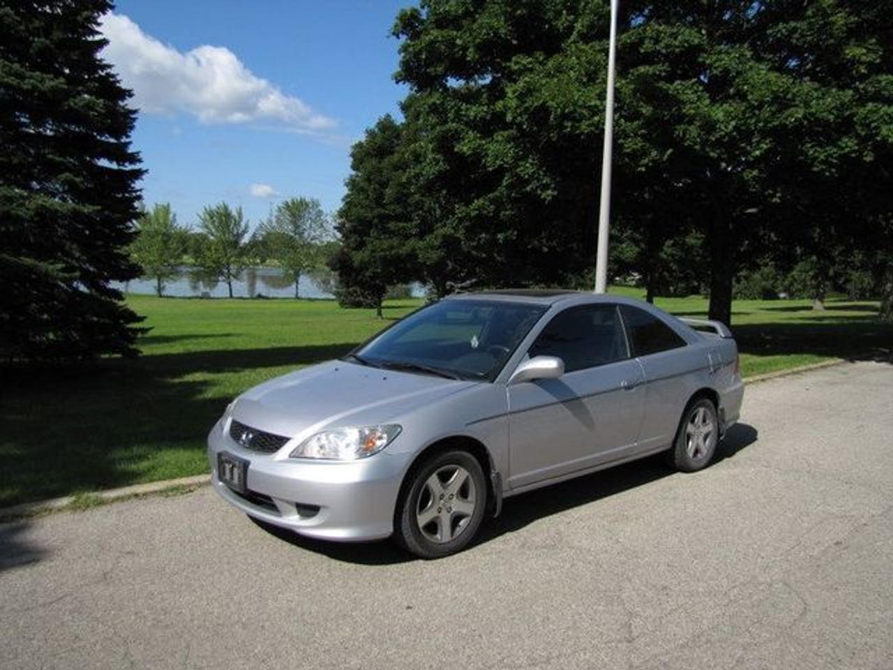 This 2004 Honda Civic 2dr Si GREAT SHAPE!! SUNROOF! AUTO!! Coupe features a 1.7L L4 PFI SOHC 4 cyl Gasoline engine. It is equipped with a Automatic transmission. The vehicle is Silver with a Black Cloth interior. Over 400 BETTER used cars in stock!! PLEASE CALL 1-866-348-8146 5.74% Financing + no payments up to 6 months available on approved credit!! Free Trial Exchange!! A+ Better Business Bureau rating!! Voted Guelphs Favourite dealer 2004-2009!! Since 1961. Taxes, licensing, and $5.00 OMVIC fee are extra. Call for details on our Free Trial Exchange! Thank you for considering Wilsons!!! Please call 1-866-348-8146. - This Honda is in Excellent overall exterior condition, Excellent overall interior condition, Cloth seats - Air Conditioning, Cruise Control, Power Steering, Power Windows, Power Door Locks, Power Mirrors, Leather Steering Wheel, Clock, Tachometer, Tilt Steering Wheel, Sunroof, Driver Airbag, Passenger Airbag, Keyless Entry, ABS Brakes, Rear Defogger, Intermittent Wipers, AM-FM, CD Player, Aluminum Wheels, Cloth Interior Surface, Rear Spoiler, Rear Spoiler - Contact The Internet Department at 866-738-6045 or leads@markwilsonsbetterusedcarstc.dealer.com for more information. -