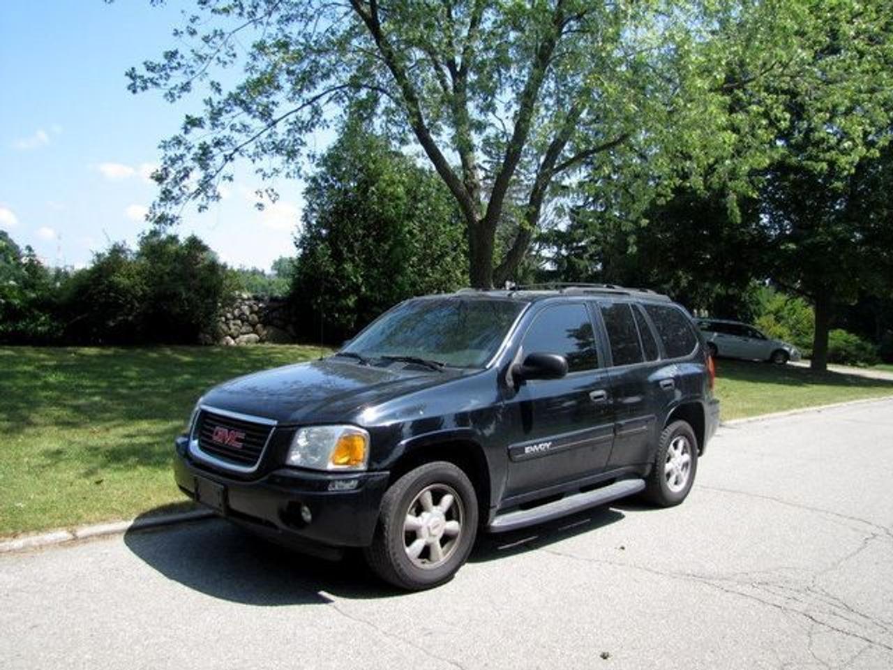 This 2004 GMC Envoy SLE 4WD RUNNING BOARDS!! 4x4 SUV features a 4.2L V6 MPI 6cyl Gasoline engine. It is equipped with a 4 Speed Automatic transmission. The vehicle is Black with a Grey Cloth interior. Over 400 BETTER used cars in stock!! PLEASE CALL 1-866-348-8146 5.99% Financing + no payments up to 6 months available on approved credit!! Free Trial Exchange!! A+ Better Business Bureau rating!! Voted Guelphs Favourite dealer 2004-2009!! Since 1961. Taxes, licensing, and $5.00 OMVIC fee are extra. Call for details on our Free Trial Exchange! Thank you for considering Wilsons!!! Please call 1-866-348-8146. - This GMC is in Average overall exterior condition, Average overall interior condition, Cloth seats - Air Conditioning, Climate Control, Cruise Control, Power Steering, Power Windows, Power Door Locks, Power Mirrors, Power Drivers Seat, Tow Package, Roof Rack, Clock, Tachometer, Digital Info Center, Tilt Steering Wheel, Driver Airbag, Passenger Airbag, Keyless Entry, ABS Brakes, Rear Defogger, Fog Lights, Intermittent Wipers, AM-FM, CD Player, Alloy Wheels, Cloth Interior Surface, Four Wheel Drive - Contact The Internet Department at 866-738-6045 or leads@markwilsonsbetterusedcarstc.dealer.com for more information. -