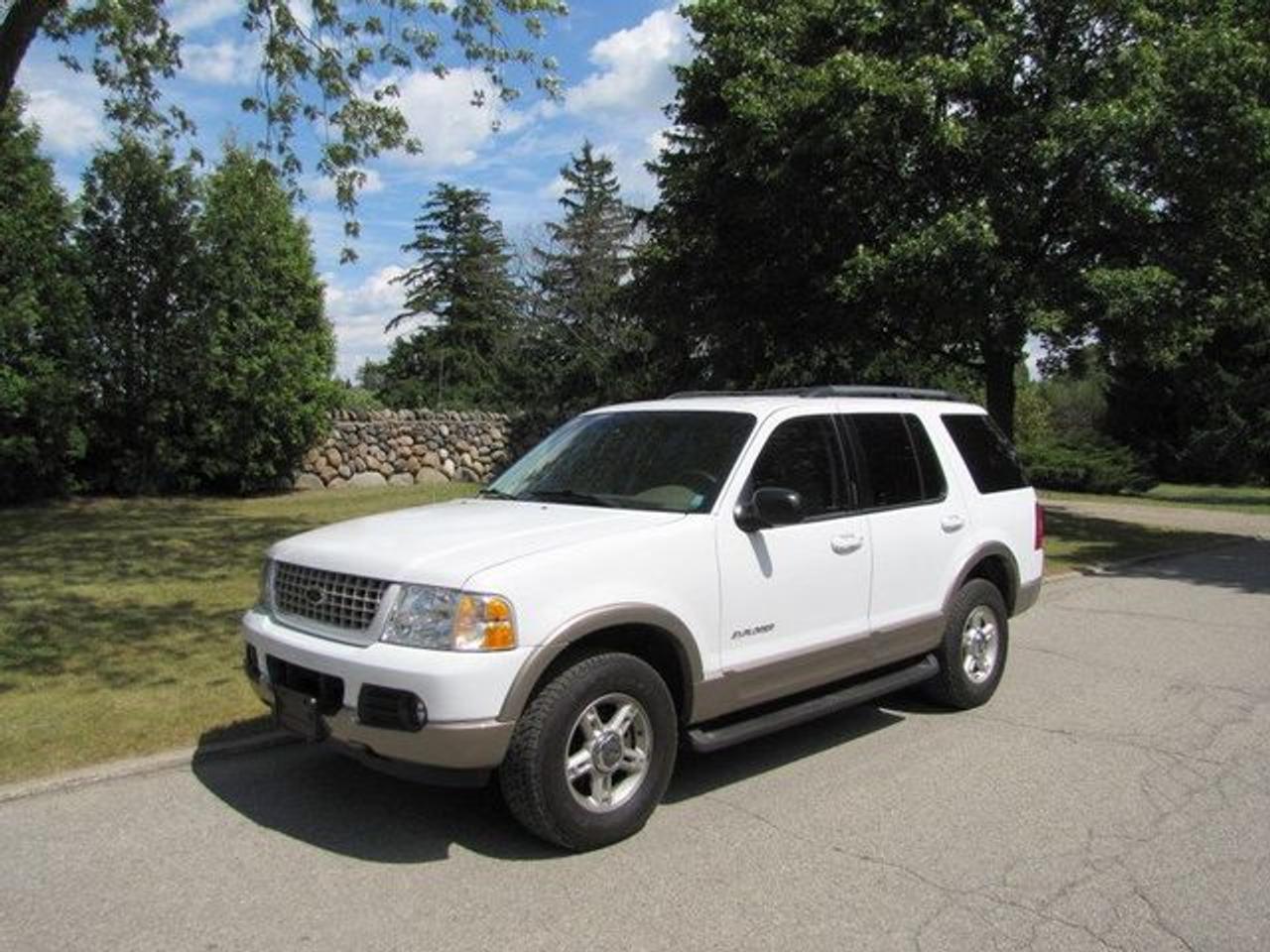 This 2002 Ford Explorer 4dr EDDIE BAUER MINT!!! TIRES LIKE NEW!! 7 PASS!! 2 TONE! 4x4 SUV features a 4.6L V8 FI SOHC 16V 8 cyl Gasoline engine. It is equipped with a Automatic transmission. The vehicle is White with a Grey Leather interior. It is covered by a limited warranty. Over 400 BETTER used cars in stock!! PLEASE CALL 1-866-348-8146 Free Trial Exchange!! A+ Better Business Bureau rating!! Voted Guelphs Favourite dealer 2004-2009!! Since 1961. Taxes, licensing, and $5.00 OMVIC fee are extra. Call for details on our Free Trial Exchange! Thank you for considering Wilsons!!! Please call 1-866-348-8146. - This Ford is in Excellent overall exterior condition, Excellent overall interior condition, Leather seats - Air Conditioning, Climate Control, Dual Zone Climate Control, Cruise Control, Tinted Windows, Power Steering, Power Windows, Power Door Locks, Power Mirrors, Leather Steering Wheel, Power Drivers Seat, Power Passenger Seat, Memory Seat Position, Tow Package, Rear Air Conditioning, Clock, Tachometer, Digital Info Center, Homelink System, Tilt Steering Wheel, Steering Wheel Radio Controls, Driver Airbag, Passenger Airbag, Keyless Entry, ABS Brakes, Traction Control, Rear Defogger, Intermittent Wipers, AM-FM, CD Player, CD Changer, Aluminum Wheels, Leather Interior Surface, Four Wheel Drive - Contact The Internet Department at 866-738-6045 or leads@markwilsonsbetterusedcarstc.dealer.com for more information. -