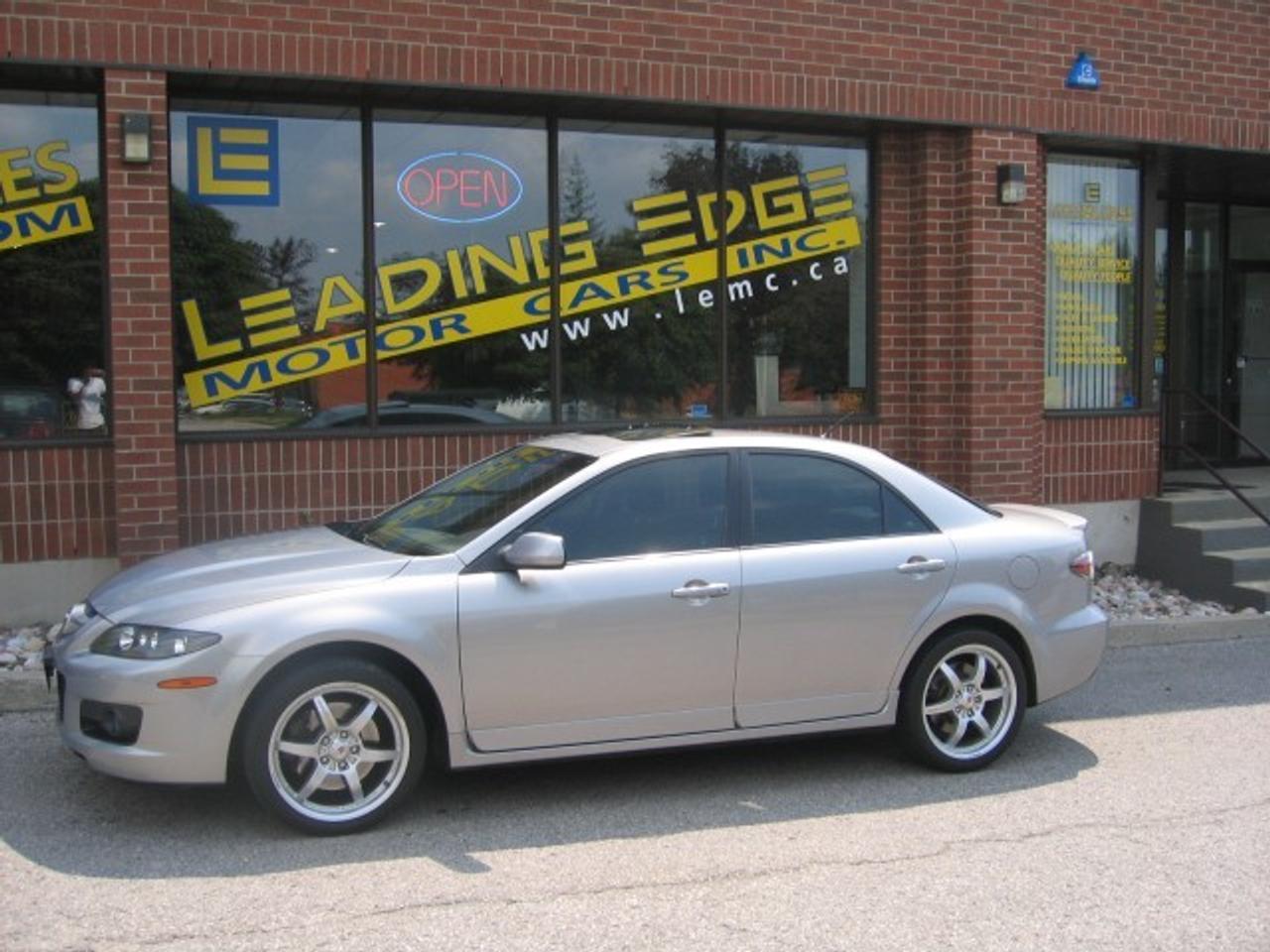 NEW ARRIVAL! THIS GREY ON BLACK BEAUTY LOOKS, RUNS, AND DRIVES ABSOLUTELY PERFECT!! MAZDASPEED6 EQUIPPED WITH ALL POWER OPTIONS, SUNROOF, HEATED LEATHER,18 MOMO CORSE RIMS, 274HORSEPOWER TURBO CHARGED ENGINE AND MORE!!! A MUST SEE AND WONT LAST!!! VISIT LEADING EDGE FOR ALL YOUR VEHICLE NEEDS TODAY.OUR VEHICLES ARE TRADE-INS AT LOCAL NEW CAR DEALERS. EACH ONE IS HAND PICKED AND APPROVED BY THE LEADING EDGE SALES TEAM. FULL HISTORY IS AVAILABLE FOR ALL OUR VEHICLES. YOUR SATISFACTION IS GUARANTEED!!! PLEASE FIND OUT MORE ABOUT US AT WWW.LEMC.CA.