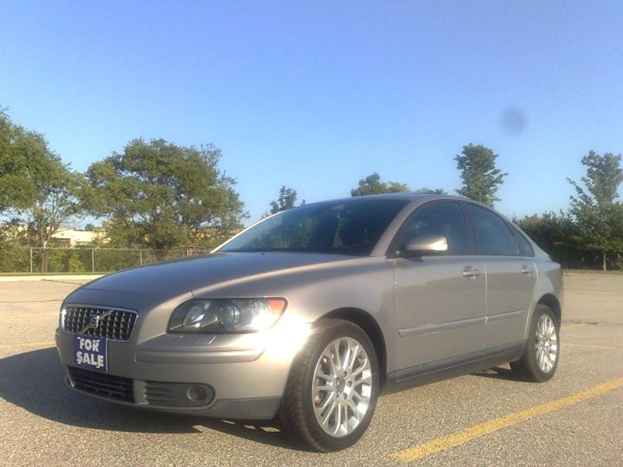 2005 Volvo S40 T5 AWD - top model, automatic-tiptronic transmission, reflect pearl gray on black leather interior, power heated memory seats, xenon lights, dual electronic climate control, Dolby Surround Pro Logic II premium sound system with 12 speakers & 6 disks CD changer, traction  control, ABS, power sunroof, 17 alloy rims,  & much more ! Very clean & nice ! 100% accident free, all original paint. Looks & drives like new! You must see! Comes certified, e-tested. CARPROOF VERIFIED ! NO HIDDEN FEES ! Just taxes are extra. Also 02 Volvo S60 auto,silver on black leather available.