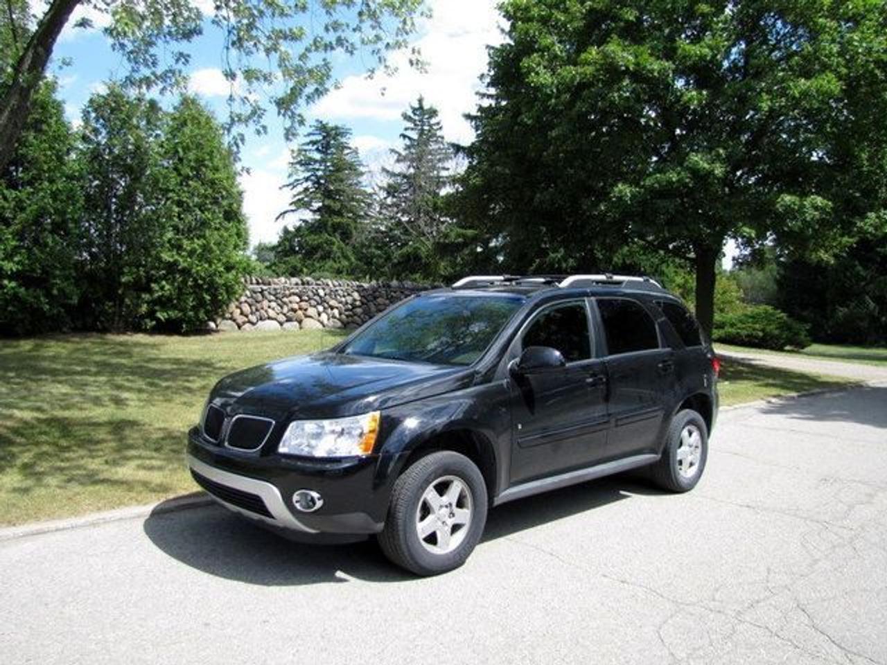 This 2006 Pontiac Torrent 4dr SUNROOF!! PWR SEATS!! GM LEASE RETURN!! SUV features a 3.4L V6 SFI 6cyl Gasoline engine. It is equipped with a Automatic transmission. The vehicle is Black with a Black Cloth interior. Over 400 BETTER used cars in stock!! PLEASE CALL 1-866-348-8146 5.99% Financing + no payments up to 6 months available on approved credit!! Free Trial Exchange!! A+ Better Business Bureau rating!! Voted Guelphs Favourite dealer 2004-2009!! Since 1961. Taxes, licensing, and $5.00 OMVIC fee are extra. Call for details on our Free Trial Exchange! Thank you for considering Wilsons!!! Please call 1-866-348-8146. - This Pontiac is in Excellent overall exterior condition, Excellent overall interior condition, Cloth seats - Air Conditioning, Cruise Control, Power Steering, Power Windows, Power Door Locks, Power Mirrors, Leather Steering Wheel, Power Drivers Seat, Power Passenger Seat, Roof Rack, Clock, Digital Info Center, Tilt Steering Wheel, Steering Wheel Radio Controls, Sunroof, Driver Airbag, Passenger Airbag, Keyless Entry, ABS Brakes, Traction Control, Rear Defogger, Fog Lights, Intermittent Wipers, AM-FM, CD Player, Alloy Wheels, Cloth Interior Surface - Contact The Internet Department at 866-738-6045 or leads@markwilsonsbetterusedcarstc.dealer.com for more information. -