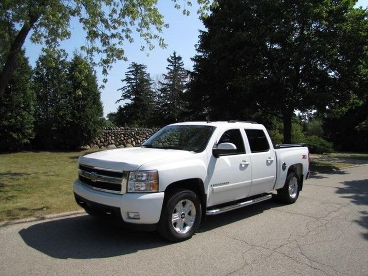 This 2007 Chevrolet Silverado 1500 LTZ Z71 OFF ROAD!! LTHR-ROOF! NEW TIRES! GM LEASE RETN 4x4 Truck features a 5.3L V8 SFI 8cyl Gasoline engine. It is equipped with a Automatic transmission. The vehicle is White with a Black Leather interior. It is offered with the remaining factory warranty. Over 400 BETTER used cars in stock!! PLEASE CALL 1-866-348-8146 5.99% Financing + no payments up to 6 months available on approved credit!! Free Trial Exchange!! A+ Better Business Bureau rating!! Voted Guelphs Favourite dealer 2004-2009!! Since 1961. Taxes, licensing, and $5.00 OMVIC fee are extra. Call for details on our Free Trial Exchange! Thank you for considering Wilsons!!! Please call 1-866-348-8146. - This Chevrolet is in Excellent overall exterior condition, Excellent overall interior condition, Leather seats - Air Conditioning, Climate Control, Dual Zone Climate Control, Cruise Control, Power Steering, Power Windows, Power Door Locks, Power Mirrors, Leather Steering Wheel, Power Drivers Seat, Power Passenger Seat, Heated Seat, Tow Package, Clock, Tachometer, Digital Info Center, Tilt Steering Wheel, Steering Wheel Radio Controls, Sunroof, Driver Airbag, Passenger Airbag, Keyless Entry, ABS Brakes, Traction Control, Intermittent Wipers, AM-FM, CD Player, Alloy Wheels, Leather Interior Surface, Four Wheel Drive, Bedliner, Running Boards, OnStar, Remote Start - Contact The Internet Department at 866-738-6045 or leads@markwilsonsbetterusedcarstc.dealer.com for more information. -