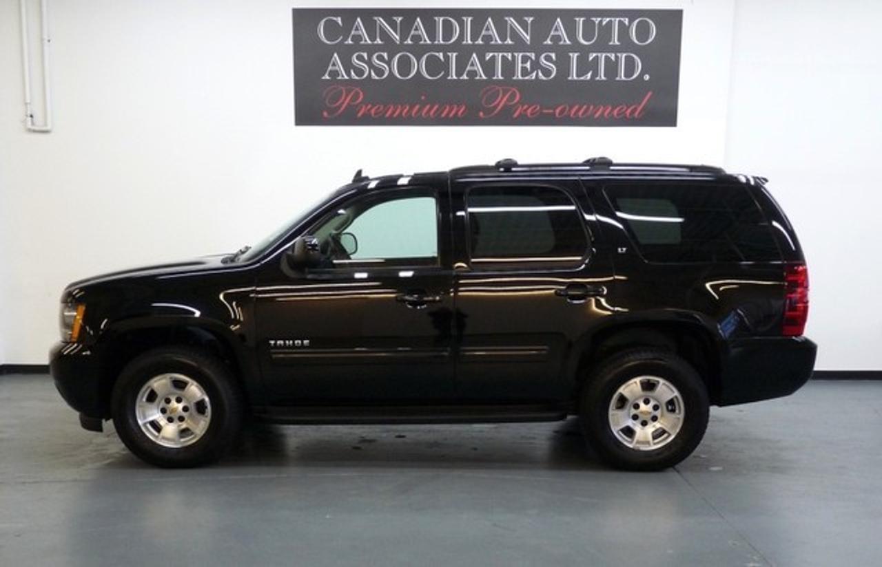 WHY BUY NEW ??? 5.3L V8 Flex Fuel, Leather, 8 Passenger, Power Seats,  Dual Zone Climate Control, Woodgrain Interior Package, Power Adjustable Pedals, 6 Disc CD/MP3, OnStar, HomeLink, Traction Control, Running Boards, Stability Control,  Alloys, Privacy Glass, Anti-theft, Keyless Entry and more. Premium Pre-Owned Certified. The balance of Manufacturers warranty applies. We offer flexible finance options with top trade allowances. Contact one of our sales professionals regarding this opportunity !!! Visit our website to view 20+ photos & FREE CARFAX with a buy back guarantee. www.canadianautoassociates.com  No Hidden Fees: Advertised Price +HST +Lic.  Previous US Rental.  Vehicle equipped as photographed and demonstrated