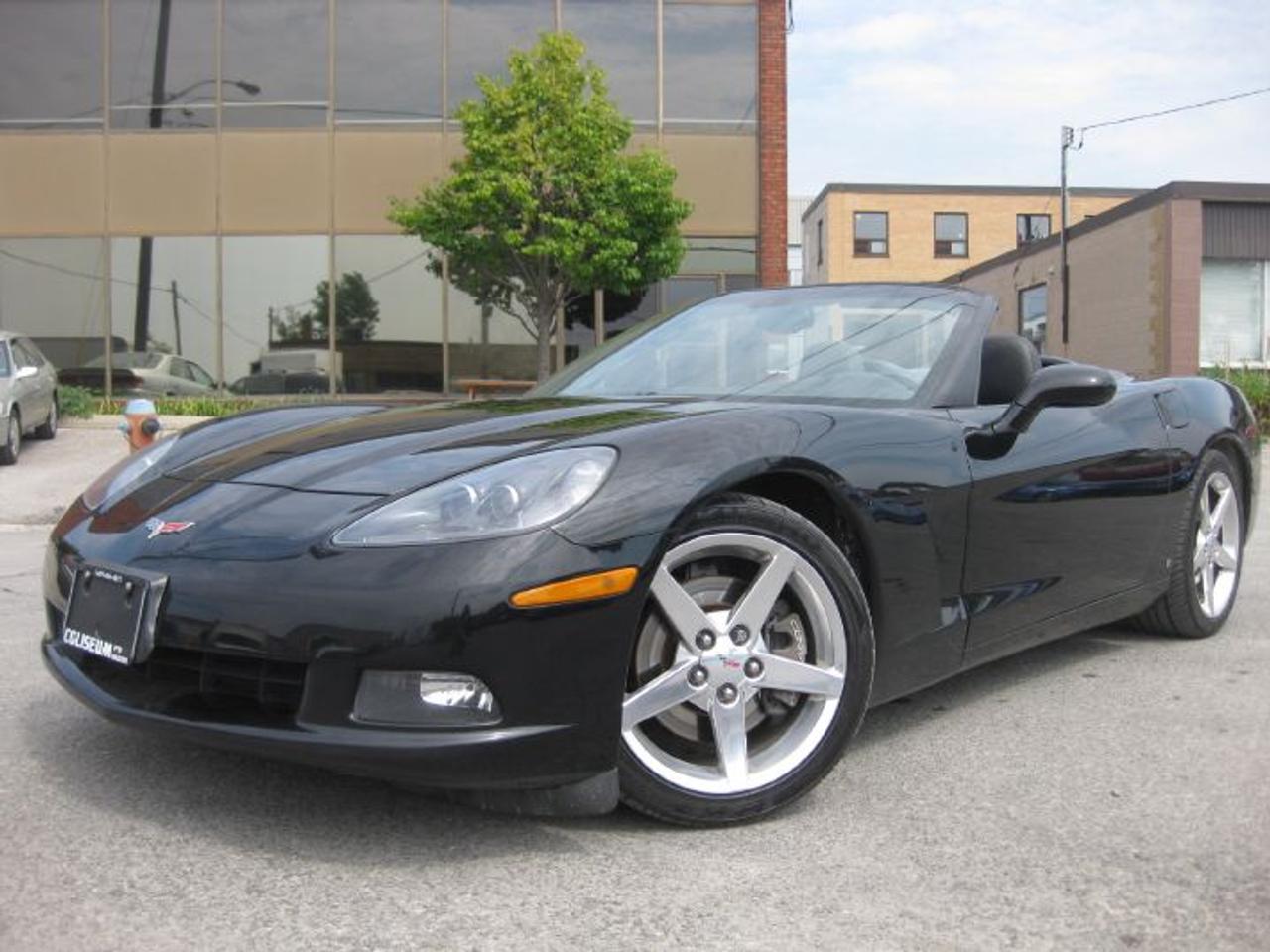 FEEL THE POWER OF THIS ONE OF A KIND AMERICAN DREAM MACHINE!! SEXXXY TRIPLE BLACK RAGTOP!! 6 SPEED MANUAL!! 1 OWNER OFF LEASE FROM GMAC!! CANADIAN CAR!! NO ACCIDENTS!! CARPROOF VERIFIED!! BRAND NEW TIRES!! NEW BRAKES & MORE!! DONT MISS OUT ON THIS RARE OPPORTUNITY TO OWN THIS ICONIC SUPER CAR!!