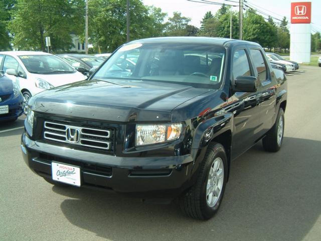 2006 Honda Ridgeline EX-L with Sunroof  This vehicle is fully equipped with all the power  options, and leather interior.  Very clean inside  and out.  Includes a rear tonneau cover.  All  service has been completed up to date, including  the Timing Belt.  Warranty Information: Factory Warranty remaining until 2011 or 100k. Honda Certified warranty available which extends  the warranty until 2012 or 120k.  FINANCING AVAILABLE!  Only: $24950  WWW.CENTENNIALHONDA.COM WWW.FACEBOOK.COM/CENTENNIALHONDA  Come visit us at Centennial Honda, located at  610 South Drive in Summerside.  We are only  45 Minutes from Charlottetown! Call us toll-free at 1 877 339-6030