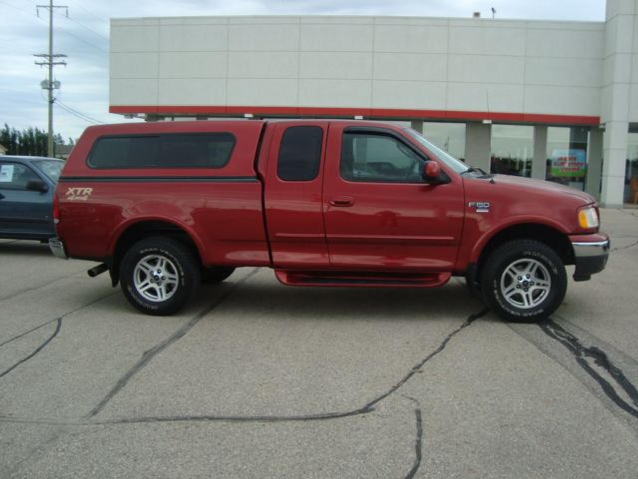 Air Conditioning
Alloy Wheels
AM/FM Stereo
Anti-Lock Brakes
Anti-Starter
Anti-Theft
Bench Seating
Box Liner
CD Player
Cruise Control
Driver Side Airbag
Dual Airbag
Fog Lights
Intermittent Wipers
Keyless Entry
Passenger Airbag
Power Brakes
Power Locks
Power Mirrors
Power Steering
Power Windows
Running Boards
Tilt Steering
Tinted Glass
Tow Package
Truck Cap