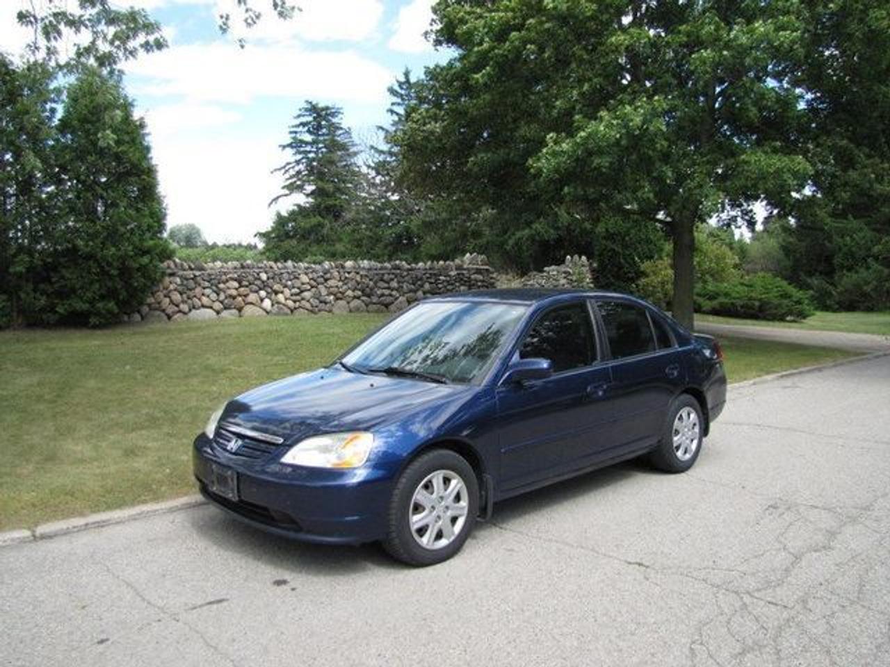 This 2003 Honda Civic 4dr LX AS-IS!! RUNS GREAT!! Sedan features a 1.7L L4 PFI SOHC 16V 4 cyl Gasoline engine. It is equipped with a Automatic transmission. The vehicle is Blue with a Grey Cloth interior. Over 400 Better used cars in stock!! PLEASE CALL 1-866-348-8146 A+ Better Business Bureau rating!! Voted Guelphs Favourite dealer 2004-2009!! Since 1961. Taxes, licensing and $5.00 OMVIC fee are extra. Better pictures at www.shopwilsons.com .WE ARE SELLING THIS ONE AS IS and we are required by law to state, even if this vehicle is perfect: Vehicle is not in roadworthy condition, not certified and not e-tested. THIS VEHICLE MAY EVEN HAVE MANUFACTURERS WARRANTY, AND IT MAY BE THE CAR FOR YOU, AT A PRICE YOU CAN AFFORD!!! SAFETY+ E-TEST AVAILABLE FOR $595.00!! - This Honda is in Excellent overall exterior condition, Excellent overall interior condition, Cloth seats - Air Conditioning, Cruise Control, Power Steering, Power Windows, Power Door Locks, Power Mirrors, Tilt Steering Wheel, Driver Airbag, Passenger Airbag, Keyless Entry, ABS Brakes, Rear Defogger, AM-FM, CD Player, Wheels, Cloth Interior Surface - Contact The Internet Department at 866-738-6045 or leads@markwilsonsbetterusedcarstc.dealer.com for more information. -