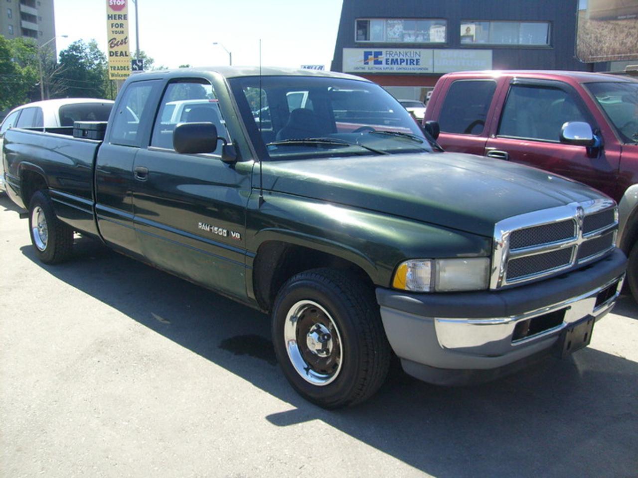 5.2L V8, auto.  Runs and drives very well. Plus HST.