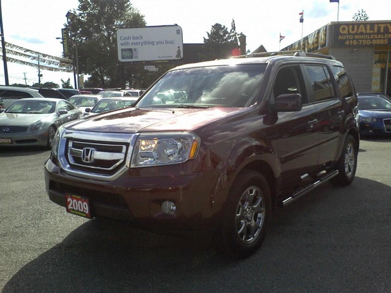 FREE G.P.S OR DUAL DVD ON THE HEADRESTS!! FREE 1-YEAR UNLIMITED KILOMETER POWER-TRAIN WARRANTY!!48k!, Maroon on Black Leather Interior, P/Sunroof, 17\Alloys, CD, Auto, Cl. Control, Power & Heated Seats, Fully Loaded! 8Passenger, Running Board,  All vehicles offered for sale are Retail.Taxes are not included. <br />Free GPS or Head rest DVD with finance deals only(O.A.C).Installation charges Extra.Free GPS/DVD is valid only for Finance Deals based on Full Asking Price.