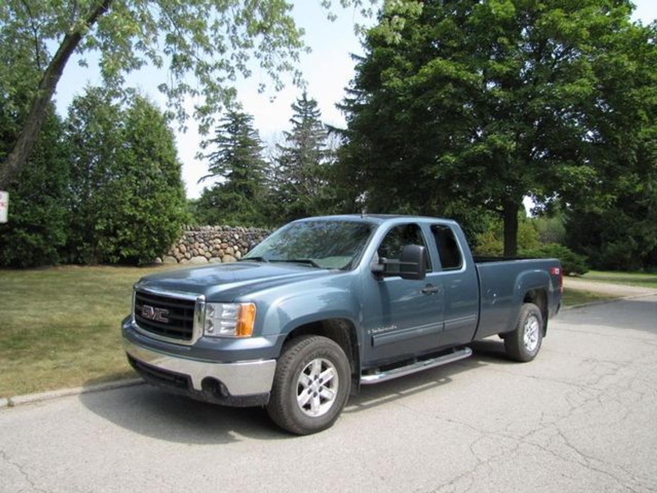 This 2007 GMC Sierra 1500 SLE MED DUTY!! LONG BOX!! GM LEASE RETURN!! 4x4 Truck features a 5.3L V8 SFI 8 cyl Gasoline engine. It is equipped with a Automatic transmission. The vehicle is Blue with a Grey Cloth interior. It is offered with the remaining factory warranty. Over 400 BETTER used cars in stock!! PLEASE CALL 1-866-348-8146 5.99% Financing + no payments up to 6 months available on approved credit!! Free Trial Exchange!! A+ Better Business Bureau rating!! Voted Guelphs Favorite dealer 2004-2009!! Since 1961. Taxes, licensing, and $5.00 OMVIC fee are extra. Call for details on our Free Trial Exchange! Thank you for considering Wilsons!!! Please call 1-866-348-8146 - This GMC is in Excellent overall exterior condition, Excellent overall interior condition, Cloth seats - Air Conditioning, Climate Control, Dual Zone Climate Control, Cruise Control, Power Steering, Power Windows, Power Door Locks, Power Mirrors, Leather Steering Wheel, Power Drivers Seat, Tow Package, Clock, Tachometer, Digital Info Center, Tilt Steering Wheel, Steering Wheel Radio Controls, Driver Airbag, Passenger Airbag, Keyless Entry, ABS Brakes, Traction Control, Intermittent Wipers, AM-FM, CD Player, Alloy Wheels, Cloth Interior Surface, Four Wheel Drive, Bedliner, Running Boards, OnStar - Contact The Internet Department at 866-738-6045 or leads@markwilsonsbetterusedcarstc.dealer.com for more information. -
