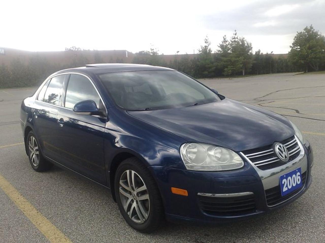 2006 Volkswagen Jetta 2.5 PREMIUM automatic-tiptronic 6 transmission. Shadow Blue on gray leather interior, fully loaded incl. power windows & locks, A/C, ABS, traction control, cruise, power memory heated seats, 6 disks in-dash CD changer,  power sunroof, 16 inch alloy wheels, new tires & much more ! One owner. Off lease from VW Credit. 100% accident free, all original paint. Very clean & nice ! You must see!  CARPROOF VERIFIED. Comes certified, e-tested. NO HIDDEN FEE. Just HST is extra. Financing  & up to 3yr warranty available.