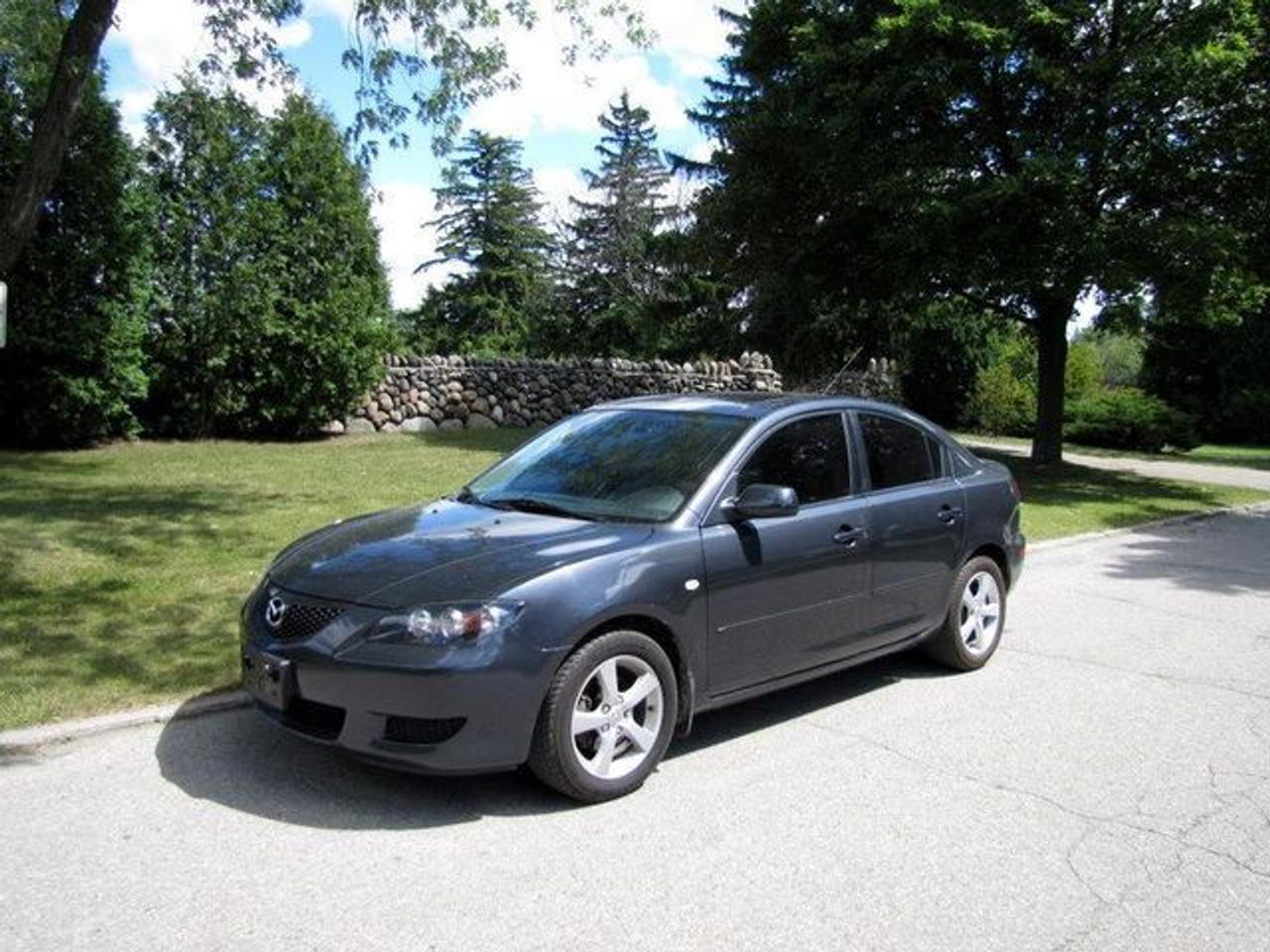 This 2006 Mazda MAZDA3 4dr GS SUNROOF!! ALLOYS!! LOADED!! MAZDA LEASE RETURN!! Sedan features a 2.0L L4 DOHC 16V 4cyl Gasoline engine. It is equipped with a Automatic transmission. The vehicle is Black with a Grey Cloth interior. It is offered with the remaining factory warranty. Over 400 BETTER used cars in stock!! PLEASE CALL 1-866-348-8146 5.99% Financing + no payments up to 6 months available on approved credit!! Free Trial Exchange!! A+ Better Business Bureau rating!! Voted Guelphs Favourite dealer 2004-2009!! Since 1961. Taxes, licensing, and $5.00 OMVIC fee are extra. Call for details on our Free Trial Exchange! Thank you for considering Wilsons!!! Please call 1-866-348-8146. - This Mazda is in Excellent overall exterior condition, Excellent overall interior condition, Cloth seats - Air Conditioning, Cruise Control, Power Steering, Power Windows, Power Door Locks, Power Mirrors, Clock, Tachometer, Digital Info Center, Tilt Steering Wheel, Sunroof, Driver Airbag, Passenger Airbag, Keyless Entry, ABS Brakes, Rear Defogger, Intermittent Wipers, AM-FM, CD Player, Alloy Wheels, Cloth Interior Surface - Contact The Internet Department at 866-738-6045 or leads@markwilsonsbetterusedcarstc.dealer.com for more information. -