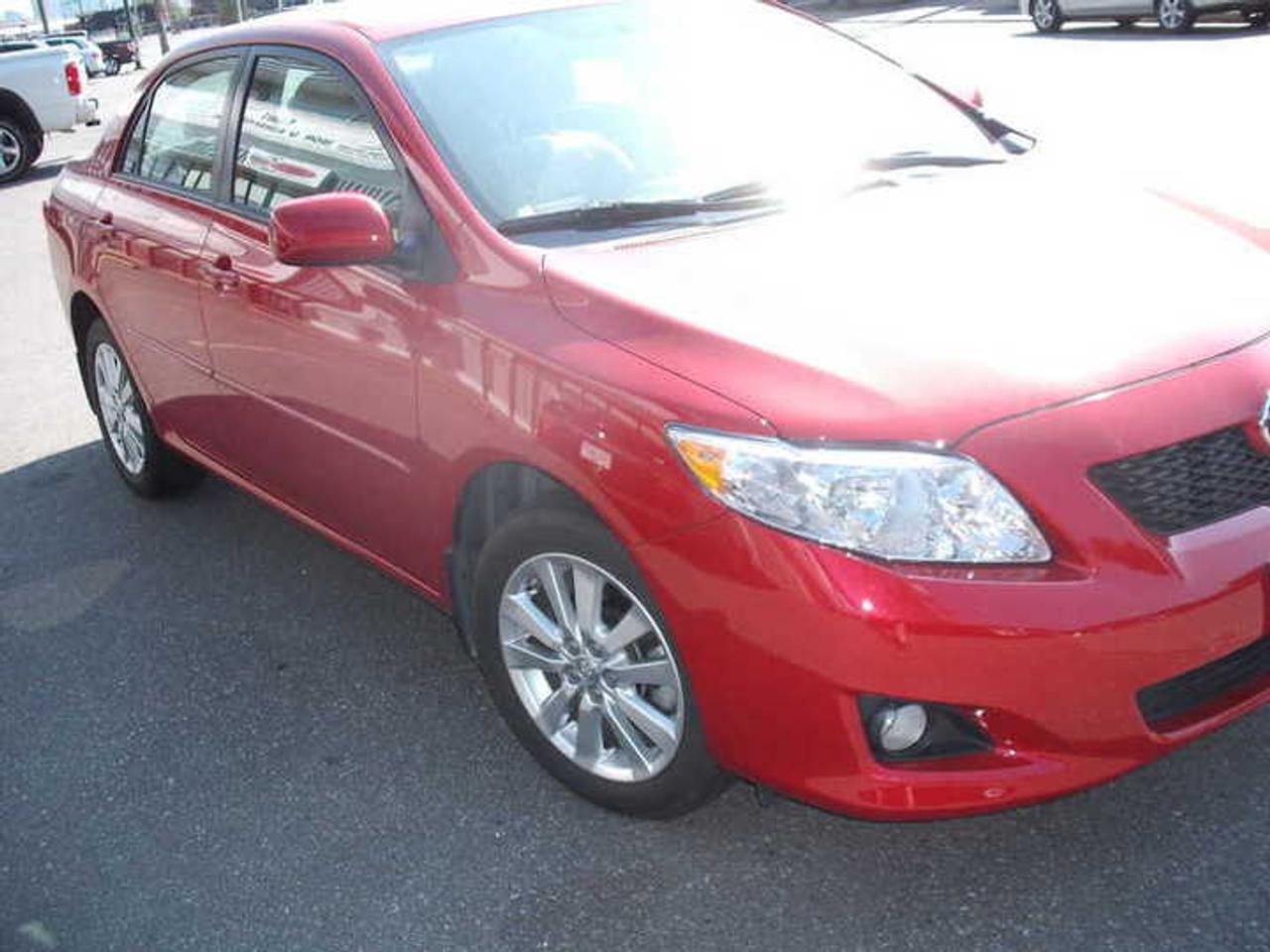 Near-new 2009 Corolla LE luxury model, Smart-key for ease of entry & operation. Loaded with luxury features & woodgrain trim; 16 multi-blade alloys; Cd in dash; dual remote entry controls; elevator seat adjustors; optional driving lamps; automatic headlamps; Top-line luxury interior; only 19Kms! Why buy a brand-new Corolla when you can save thousands on this near-new LE with so much to offer you! Get the top-line model for less than the base model new! Balance of Toyota 5-year 100,000kms Major component Warranty. Claret metallic & striking in appearance! Lease or purchase this rare offering NOW! see Auto Depot Ltd. in North Vancouver 604 985-0168 or Toll-free @ 888-269-9540 or 604 727-3111