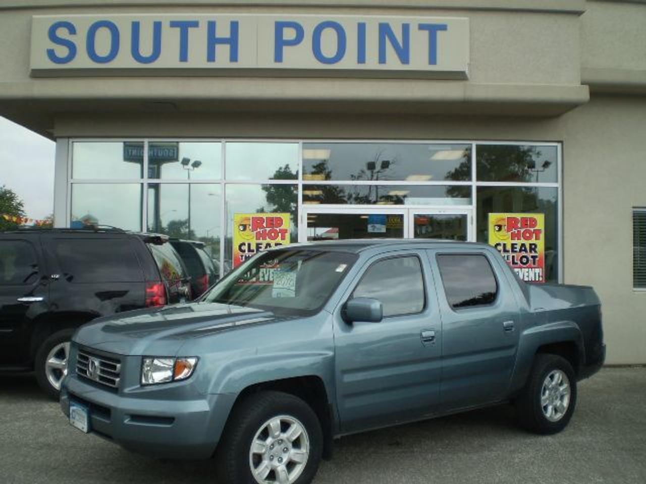 EX-L with leather interior and 4WD.  Sale Price $20995.  OVER 100 USED available WITH PICTURES at www.southpointgm.com .  Call us at 519-326-3206 or 1-866-340-1406.  H.S.T. extra.