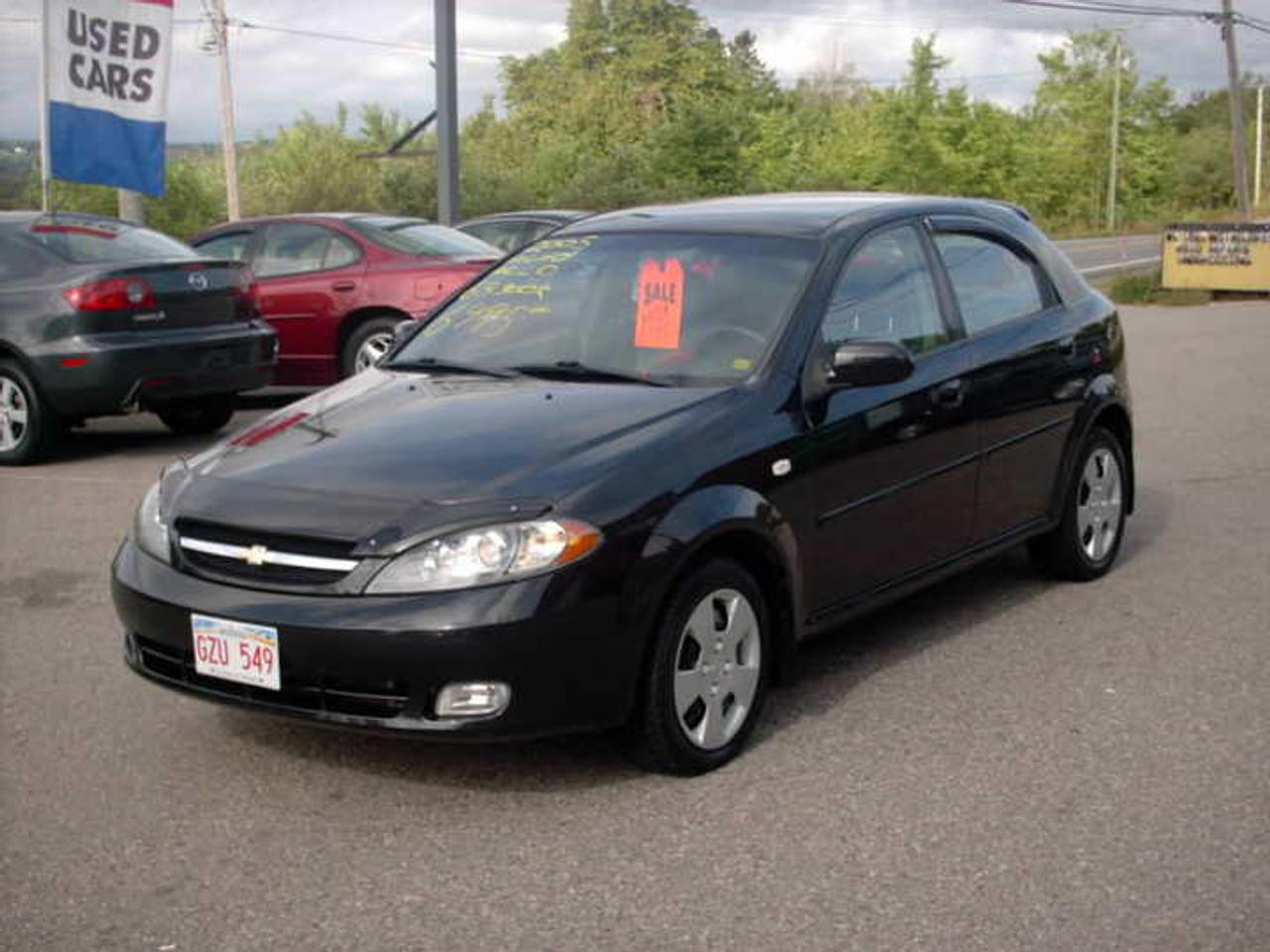 06 OPTRA 5 , 4 DOOR AUTO , A/C, CD, LOTS OF POWER , WORKS GREAT, , NICE CAR
