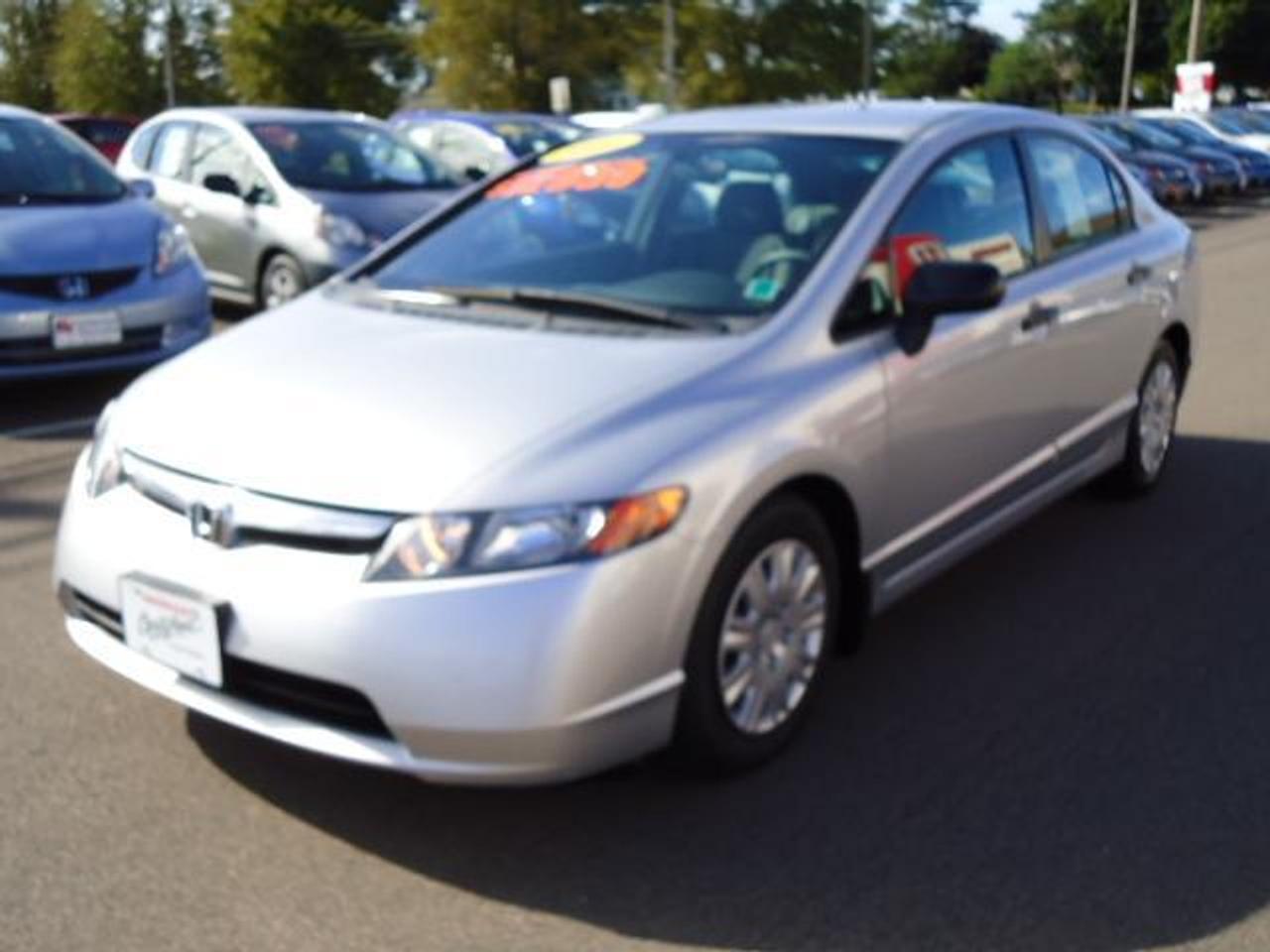 2006 HONDA CIVIC DX-G SEDAN AUTOMATIC  This is a very clean car inside and out, with  VERY low Kms.  Comes with all of the power  options including power door locks with remote  keyless entry, power windows, cd player, air  conditioning and more.  This vehicle is all  serviced up to date, and has been put through  the Honda Certified 100 point inspection.  Warranty Information: Factory Warranty remaining until 2011 or 100k. Honda Certified Warranty available which  extends the warranty until 2012 or 120k.  FINANCING AVAILABLE FROM 2.9%  Centennial Hondas Valued Pricing: $12950  WWW.CENTENNIALHONDA.COM WWW.FACEBOOK.COM/CENTENNIALHONDA  Come visit us at Centennial Honda, located at  610 South Drive in Summerside.  We are only  45 Minutes from Charlottetown! Call us toll-free at 1 877 339-6030
