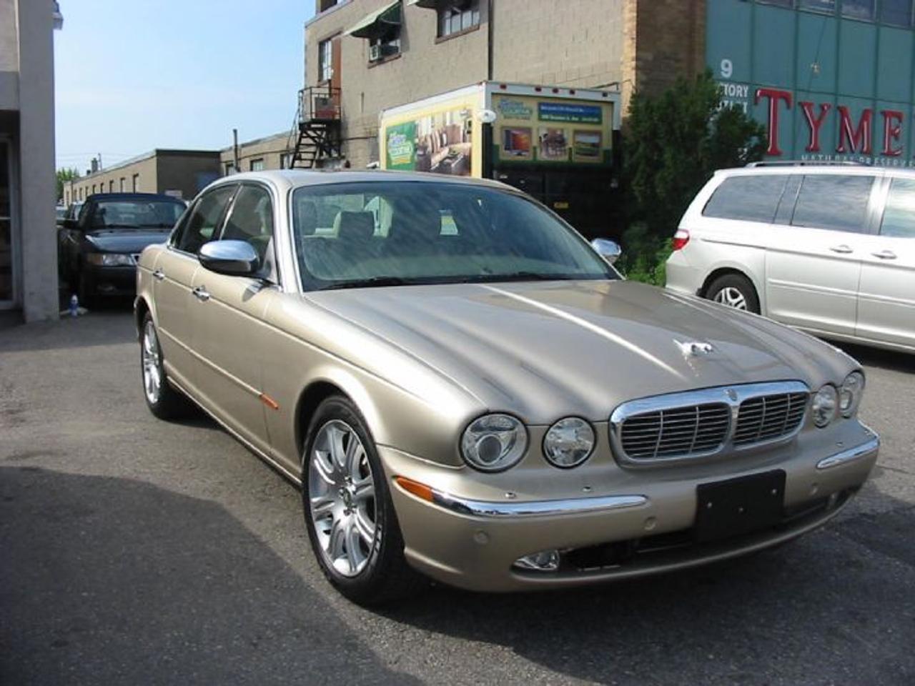 *NO BOGUS HIDDEN FEES* CAR PROOF VERIFIED! SLIP INTO THE LAP OF ENTICING LUXURY WITH THIS FULLY EQUIPPED JAGUAR VANDEN PLAS! LIGHT ALUMINUM BODY PROVIDES EXCELLENT FUEL MILEAGE COMBINED WITH A 6 SPEED AUTOMATIC TRANSMISSION! COMES WITH PARKING SENSORS FRONT AND BACK, 18 INCH PREMIUM ALLOYS, NAVIGATION, DVD WITH HEADREST SCREENS, DUAL ZONE CLIMATE, PREMIUM SOUND, POWER MOONROOF AND SO MUCH MORE! WILL BE SOLD CERT. AND E-TESTED FOR $18990 PLUS HST. AND LICENSE! WE ARE A LUBRICO WARRANTY APPROVED SERVICE FACILITY FOR ALL MAKES AND MODELS ( $ 79 PER HOUR LABOUR RATE )