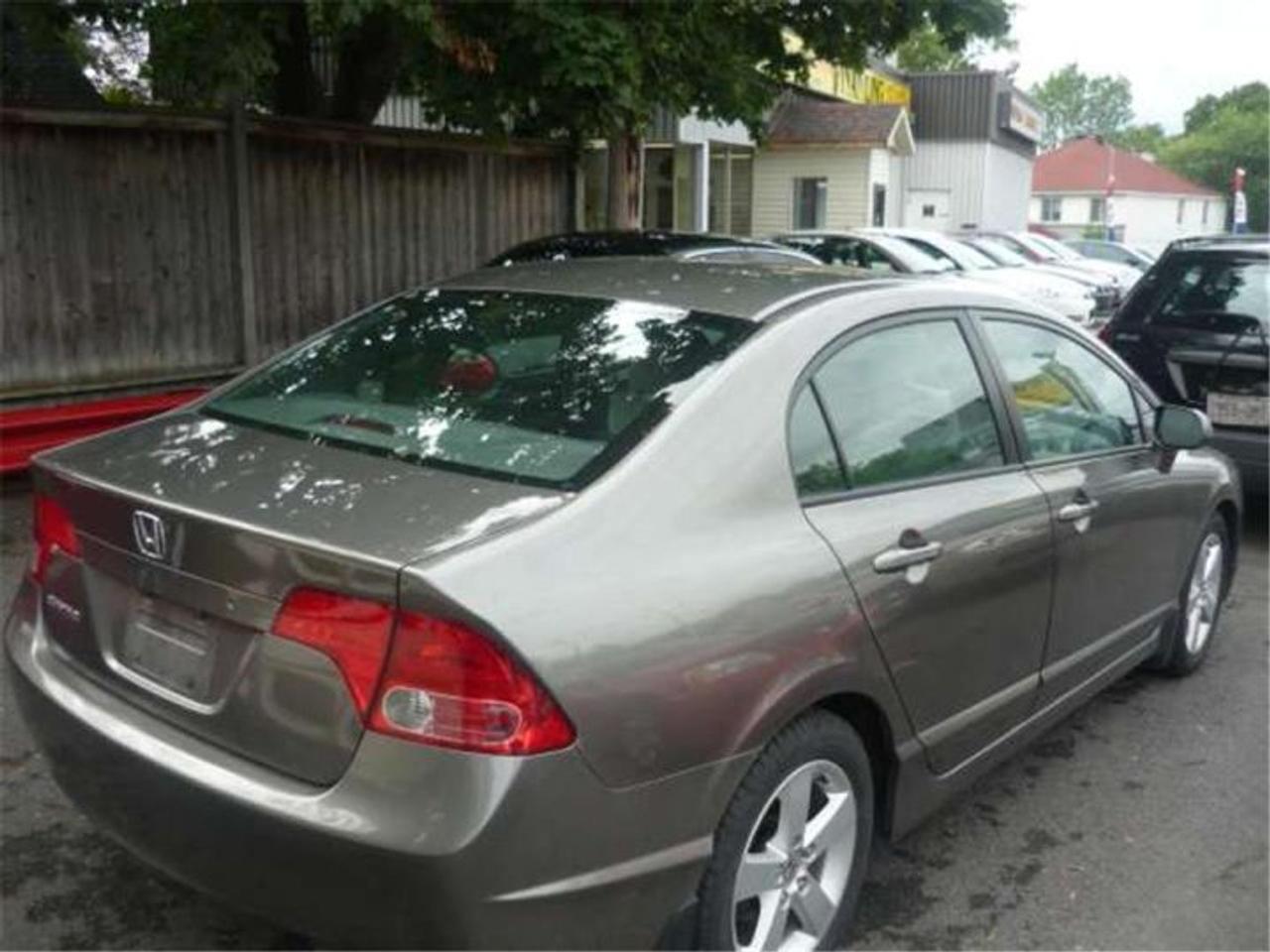 4 cylinder, 5 Speed ,109000 km, gold exterior,  grey interior. sunroof This gorgeous Honda Civic is absolutely LOADED with extras! control A/C, power windows and locks,  and more! Come in today and take it for a test drive! Price does not include HST. Good credit, bad credit or no credit, we have financing solutions for all credit scenarios. Apply online today at www.presleysauto.com. Safe, secure and fast!