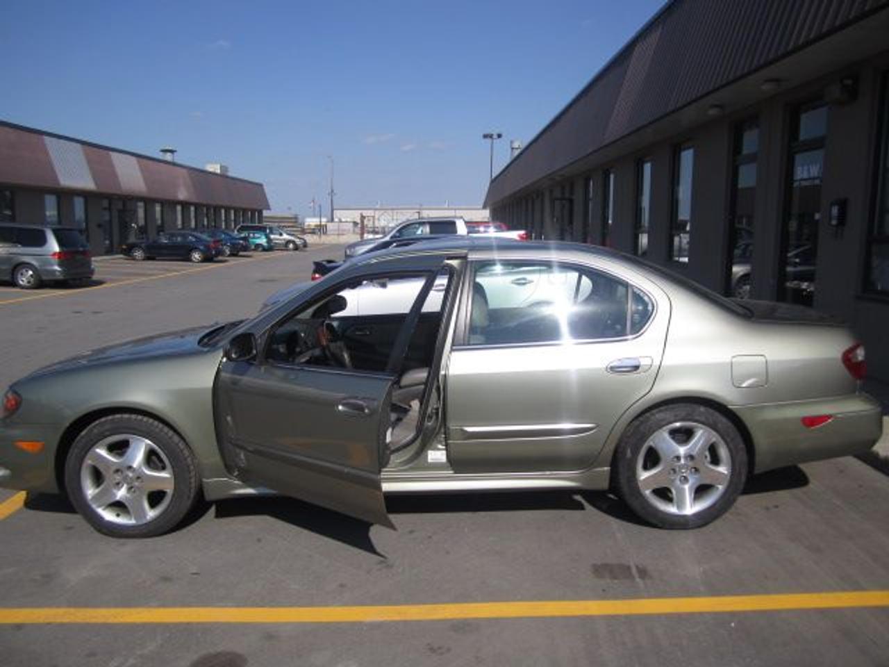 SLEEK AND SMOOTH RIDE! FULLY EQUIPPED VEHICLE. GREEN OVER BLACK LEATHER INT. SPECIAL OPTIONS INCLUDE: A/C, CD, POWER DOOR LOCKS, POWER WINDOWS, KEYLESS ENTRY, POWER SUNROOF, WOODGRAIN INTERIOR PACKAGE, ALLOY WHEELS AND MUCH MUCH MORE! EXCELLENT CONDITION. YOURS FOR $4,888 AT CHECK LIST AUTO SALES!