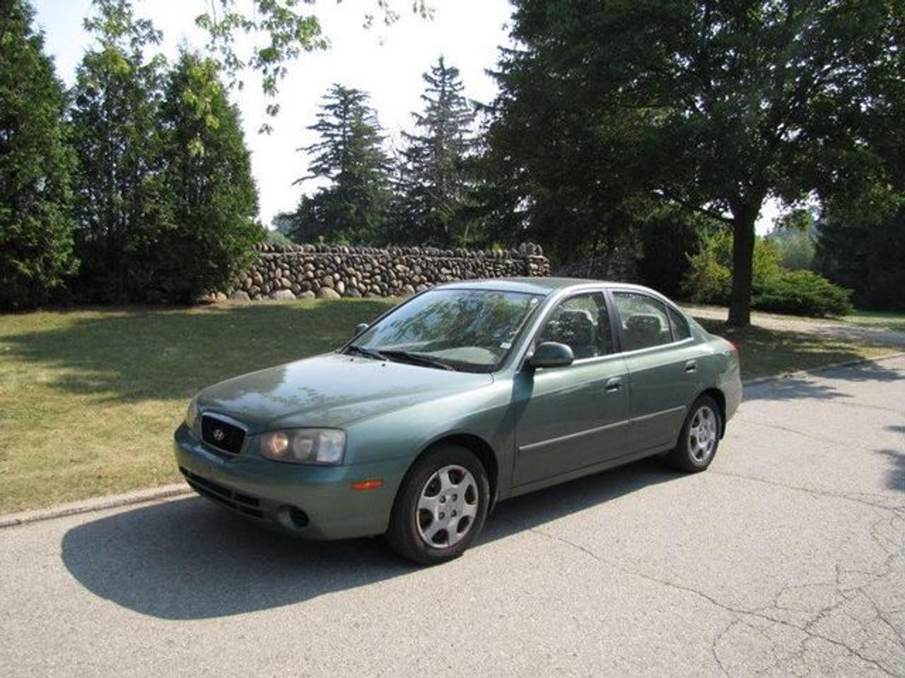 This 2001 Hyundai Elantra 4dr VE LOADED!! AS-IS!! Sedan features a 2.0L L4 MPI DOHC 16V 4 cyl Gasoline engine. It is equipped with a Automatic transmission. The vehicle is Green with a BEIGE Cloth interior. Over 400 Better used cars in stock!! PLEASE CALL 1-866-348-8146 A+ Better Business Bureau rating!! Voted Guelphs Favourite dealer 2004-2009!! Since 1961. Taxes, licensing and $5.00 OMVIC fee are extra. WE ARE SELLING THIS ONE "AS IS" and we are required by law to state, even if this vehicle is perfect: &ldquo;Vehicle is not in roadworthy condition, not certified and not e-tested.&rdquo; THIS VEHICLE MAY EVEN HAVE MANUFACTURERS WARRANTY, AND IT MAY BE THE CAR FOR YOU, AT A PRICE YOU CAN AFFORD!!! - This Hyundai is in Excellent overall exterior condition, Excellent overall interior condition, Cloth seats - Air Conditioning, Cruise Control, Power Steering, Power Windows, Power Door Locks, Power Mirrors, Clock, Tachometer, Digital Info Center, Tilt Steering Wheel, Driver Airbag, Passenger Airbag, Keyless Entry, ABS Brakes, Rear Defogger, Intermittent Wipers, AM-FM, CD Player, Wheels, Cloth Interior Surface - Contact The Internet Department at 866-738-6045 or leads@markwilsonsbetterusedcarstc.dealer.com for more information. -