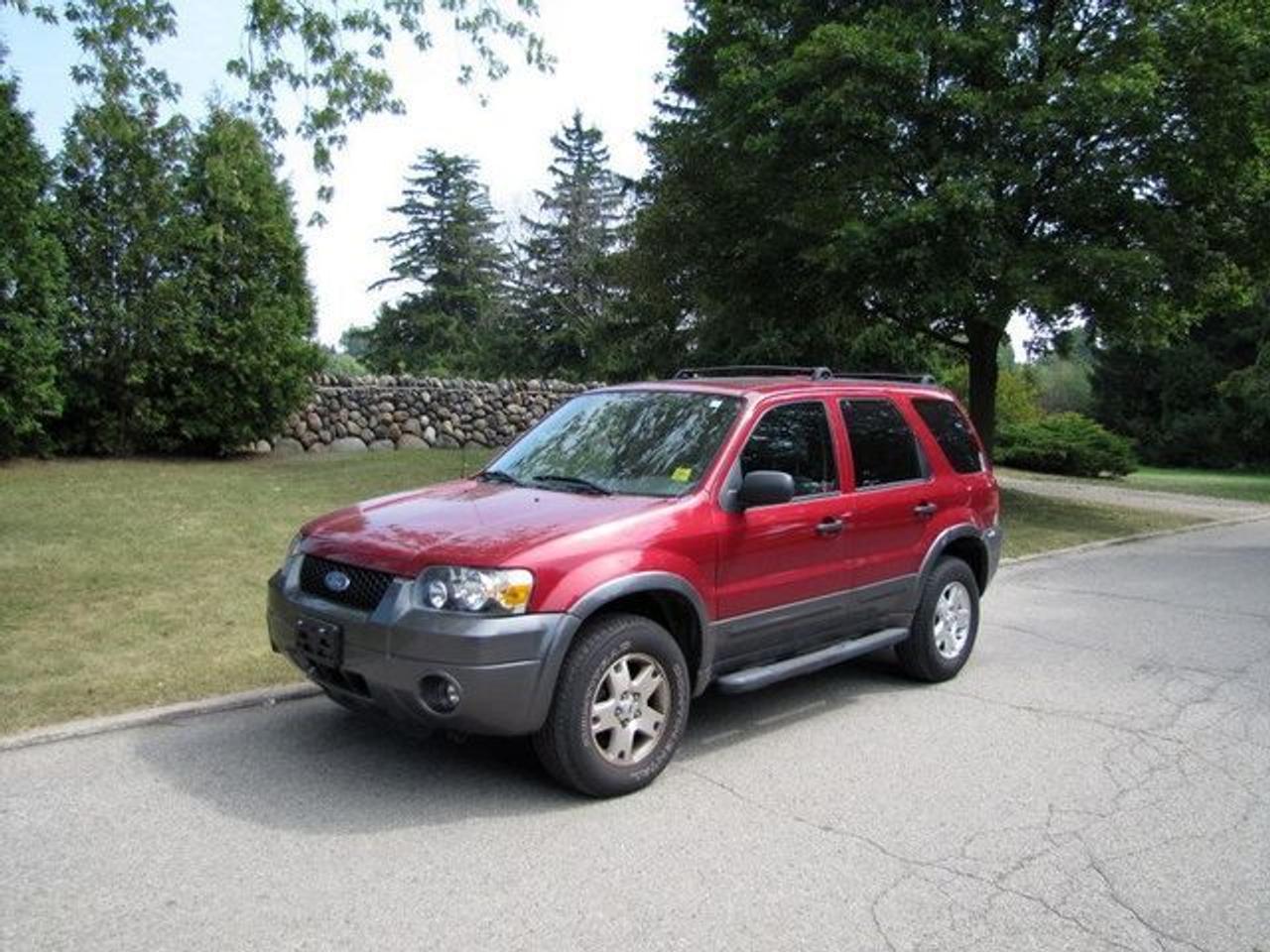 This 2006 Ford Escape 4dr XLT SUNROOF!! SIDEBARS!! MINT!! SUV features a 3.0L V6 FI DOHC 6 cyl Gasoline engine. It is equipped with a Automatic transmission. The vehicle is Red with a Grey Cloth interior. It is offered with the remaining factory warranty. Over 400 BETTER used cars in stock!! PLEASE CALL 1-866-348-8146 5.99% Financing + no payments up to 6 months available on approved credit!! Free Trial Exchange!! A+ Better Business Bureau rating!! Voted Guelphs Favourite dealer 2004-2009!! Since 1961. Taxes, licensing, and $5.00 OMVIC fee are extra. Call for details on our Free Trial Exchange! Thank you for considering Wilsons!!! Please call 1-866-348-8146. - This Ford is in Excellent overall exterior condition, Excellent overall interior condition, Cloth seats - Air Conditioning, Cruise Control, Power Steering, Power Windows, Power Door Locks, Power Mirrors, Power Drivers Seat, Roof Rack, Clock, Tachometer, Digital Info Center, Tilt Steering Wheel, Sunroof, Driver Airbag, Passenger Airbag, Keyless Entry, ABS Brakes, Rear Defogger, Intermittent Wipers, AM-FM, CD Player, Alloy Wheels, Cloth Interior Surface - Contact The Internet Department at 866-738-6045 or leads@markwilsonsbetterusedcarstc.dealer.com for more information. -