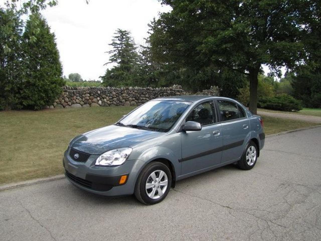 This 2009 Kia Rio 4dr EX HEATED SEATS!! LOADED!! Sedan features a 1.6L I4 CVVT DOHC 16V 4 cyl Gasoline engine. It is equipped with a Automatic transmission. The vehicle is Blue with a Grey Cloth interior. It is offered with the remaining factory warranty. Over 400 BETTER used cars in stock!! PLEASE CALL 1-866-348-8146 5.99% Financing + no payments up to 6 months available on approved credit!! Free Trial Exchange!! A+ Better Business Bureau rating!! Voted Guelphs Favourite dealer 2004-2009!! Since 1961. Taxes, licensing and $5.00 OMVIC fee are extra. Former daily rental. Call for details on our Free Trial Exchange! Thank you for considering Wilsons!!! Please call 1-866-348-8146. - This Kia is in Excellent overall exterior condition, Excellent overall interior condition, Cloth seats - Air Conditioning, Cruise Control, Power Steering, Power Windows, Power Door Locks, Power Mirrors, Heated Seat, Clock, Tachometer, Digital Info Center, Tilt Steering Wheel, Driver Airbag, Passenger Airbag, Keyless Entry, ABS Brakes, Rear Defogger, Intermittent Wipers, AM-FM, CD Player, Wheels, Cloth Interior Surface - Contact The Internet Department at 866-738-6045 or leads@markwilsonsbetterusedcarstc.dealer.com for more information. -