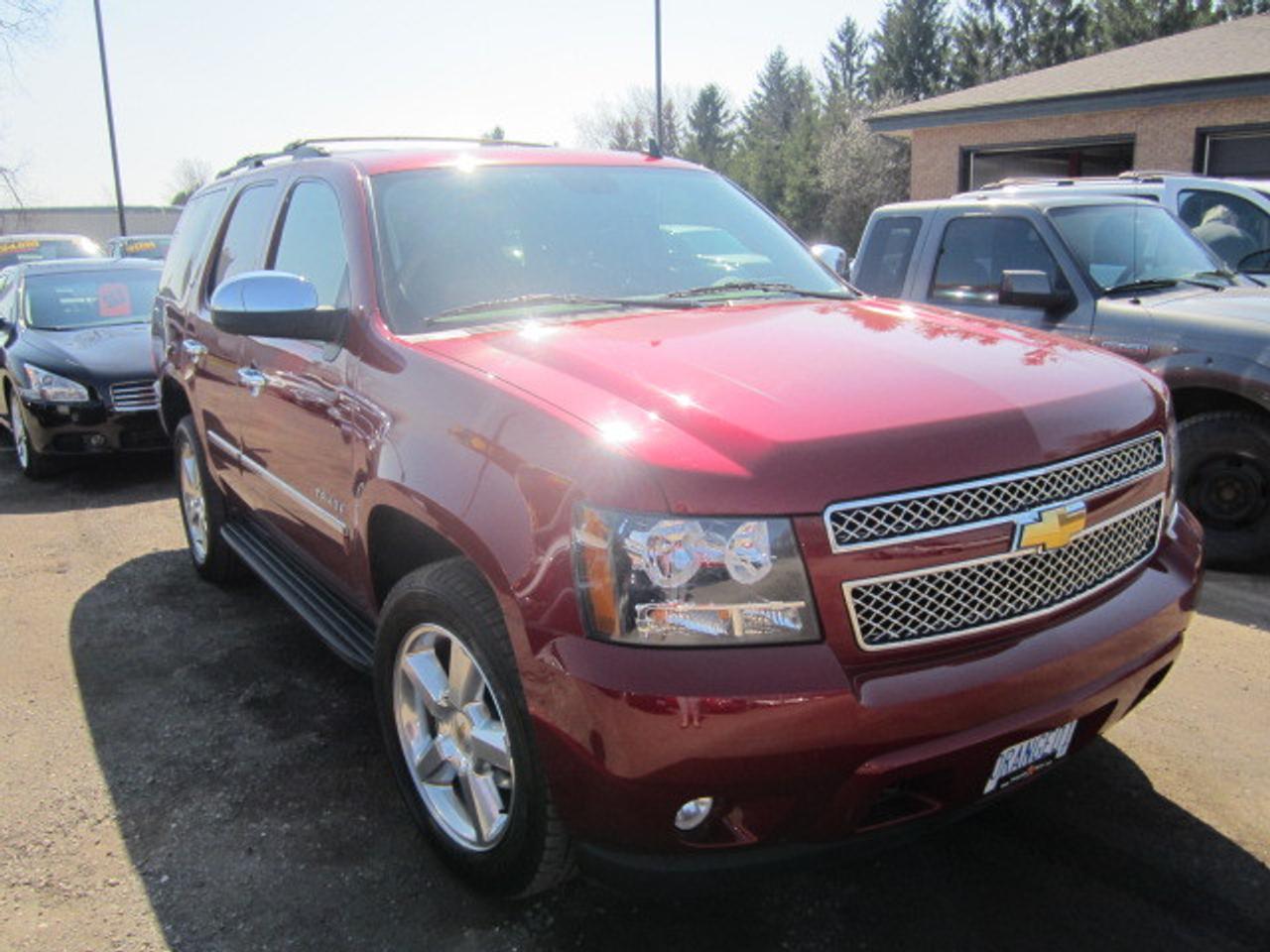 CANADIAN VEHICLE!! CLEAN CARPROOF!!  5.3 L 8 CYL ENGINE. UP TO 9.5 L/100 K ( 30 MPG). RED JEWEL TINCOAT WITH BLACK LEATHER INTERIOR. QUAD SEATING, 3RD ROW SEATING,HEATED/COOLED FRONT SEATS, HEATED SECOND ROW SEATS,CRUISE CONTROL, DVD ENTERTAINMENT PKG. SUNROOF, 20 ALLOY WHEELS AND MUCH MORE!!ALL TYPES OF FINANCING AVAILABLE. RIGOROUS CERTIFICATION & INSPECTION. NO EXTRA FEES OR HIDDEN COSTS. PLUS HST & LICENSING. FREE VEHICLE HISTORY REPORT.