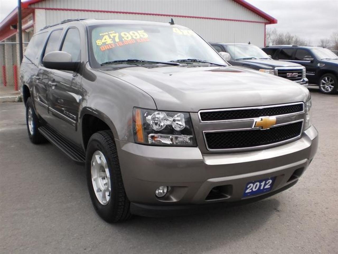 5.3L. V8.  2012 GMC SUBURBAN 8 PASSENGER WITH 4X4,REMOTE START,POWER SLIDING SUNROOF,ONSTAR,DVD,HEATED LEATHER MEMORY SEATS,HEATED 2nd ROW SEATING,LEATHER WRAPPED STEERING WHEEL WITH CONTROLS,REMOTE LIFTGATE,POWER LIFTGATE,REMOTE START,HEATED MIRRORS,XM SAT RADIO,ULTRASONIC REAR PARKING ASSIST,BOSE PREMIUM SOUND SYSTEM,USB PORT.  LOADED!!  30 Years in business, A+ BBB rated company, 200 units in stock, 2 locations.  Home of the Warranty for Life, full service department, on the spot financing.    Bad credit welcomed.    Winner of Reader Choice Award for the best dealer in the Listowel area.   Winner Of Business Of The Year Award from the North Perth Chamber Of Commerce!   Free carproof or carfax.    No extra fees no extra costs.    All prices + HST & Licensing.    Save money!   (Thanks for shopping at STOP23 AUTO SALES LTD).