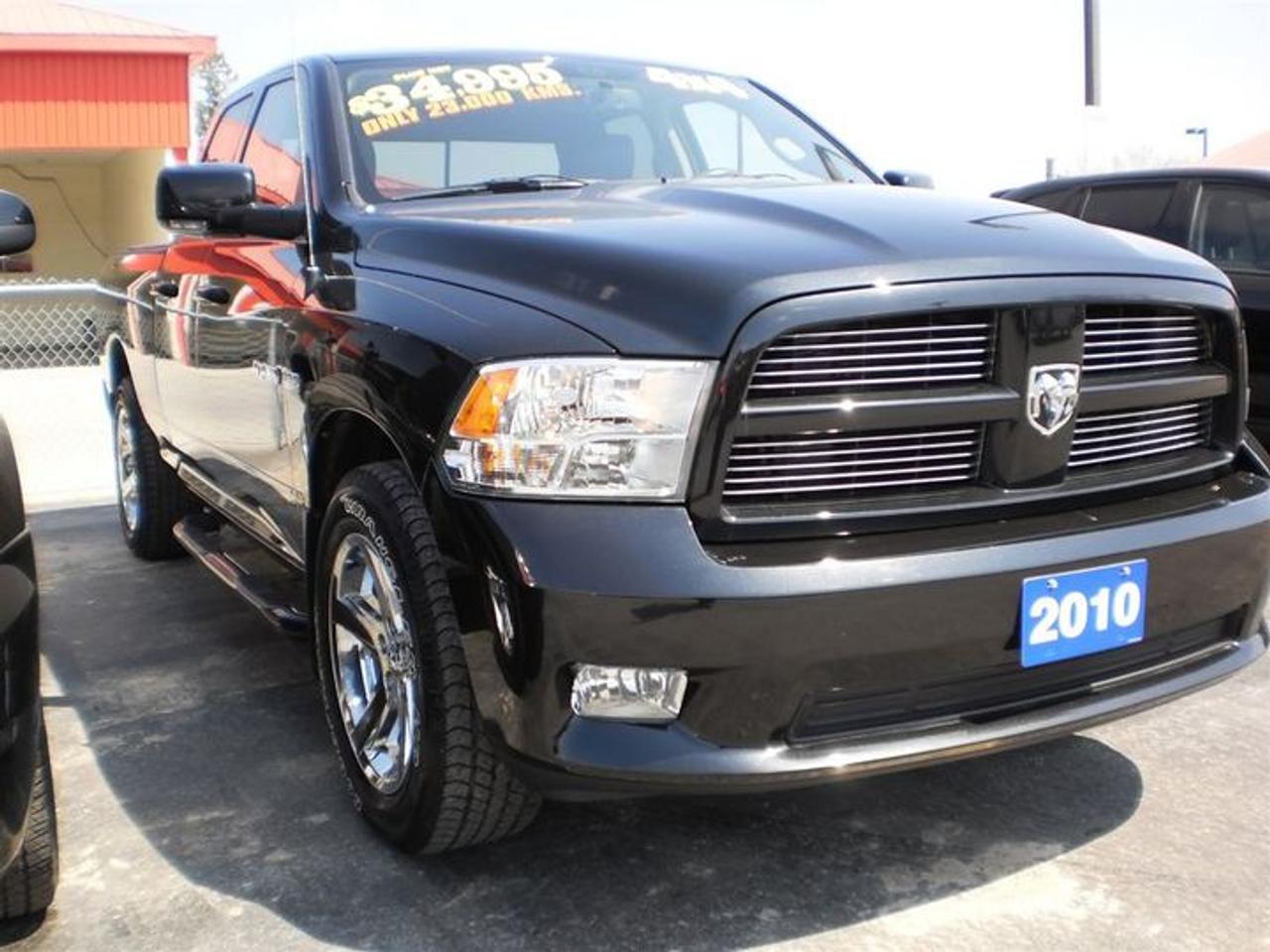 5.7L. V8.  2010 DODGE RAM 1500 QUAD CAB WITH 4X4,HEMI,HEATED AND COOLED LEATHER SEATS,FOG LIGHTS,RUNNING BOARDS,SOFT TONNEAU COVER,DUAL EXHAUST,BACKUP CAMERA,HEATED MIRRORS,LEATHER WRAPPED STEERING WHEEL WITH CONTROLS,SUNROOF,AM/FM SAT RADIO WITH SIRIUS,MP3,JPEG,WMA CAPABILITIES. LOADED!!  30 Years in business, A+ BBB rated company, 200 units in stock, 2 locations.  Home of the Warranty for Life, full service department, on the spot financing.    Bad credit welcomed.    Winner of Reader Choice Award for the best dealer in the Listowel area.   Winner Of Business Of The Year Award from the North Perth Chamber Of Commerce!   Free carproof or carfax.    No extra fees no extra costs.    All prices + HST & Licensing.    Save money!   (Thanks for shopping at STOP23 AUTO SALES LTD).