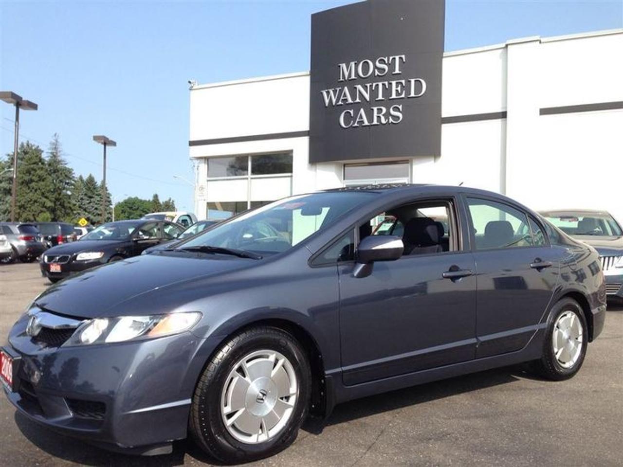 [ CARPROOF VERIFIED $0 - ACCIDENT FREE ] - BRAND NEW IMA BATTERY INSTALLED THOUGH HONDA CANADA WARRANTY -  PREVIOUS KITCHENER ONTARIO VEHICLE - CLIMATE CONTROL - ALLOY RIMS - KEYLESS ENTRY - ALL POWER OPTIONS - ABS - CRUISE CONTROL - AUX/MP3 IN - TILT + TELESCOPING STEERING - SIDE MIRRORS INDICATORS - SPOILER - HEATED OUTSIDE MIRRORS - ADJUSTABLE CENTRE CONSOL - Easy online application at WWW.THEOMOTORS.COM. Everyone and all credit welcome!! We have over 200 used Cars, Trucks, Vans and SUVs  available.! PLEASE CALL1 (519)772-3040. Ask about our exclusive  preferred financing! This ACCIDENT FREE RECENT trade comes  CERTIFIED  SERVICED  E-TESTED  and 167 point inspection at NO EXTRA CHARGE. A+ Better Business Bureau rating!! Taxes and licensing are extra. Financing special is on approved credit only, and a minimum loan of $7,500. Accrued interest must be paid on a 6-month payment deferral. Cost of borrowing a $20,000 car over a 48 month term at 4.99% is $2,377.28. THANK YOU and we appreciate  your consideration at THEOMOTORS.SERVING K-W AREA FOR OVER 30 YEARS!!