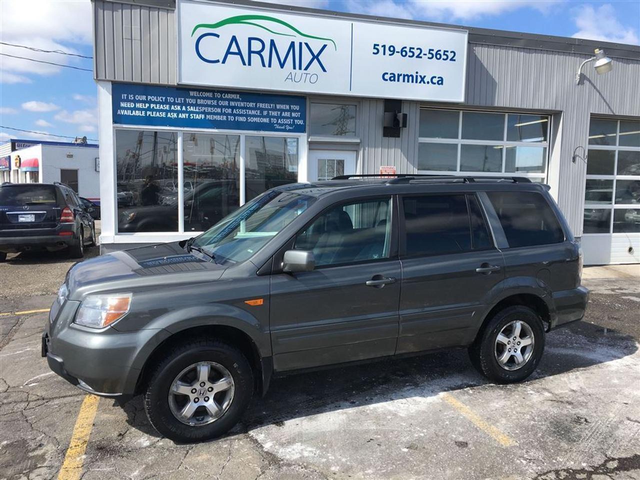 Just Arrived, beautiful 7 Passenger Pilot EXL!  Clean Carproof No Accidents.