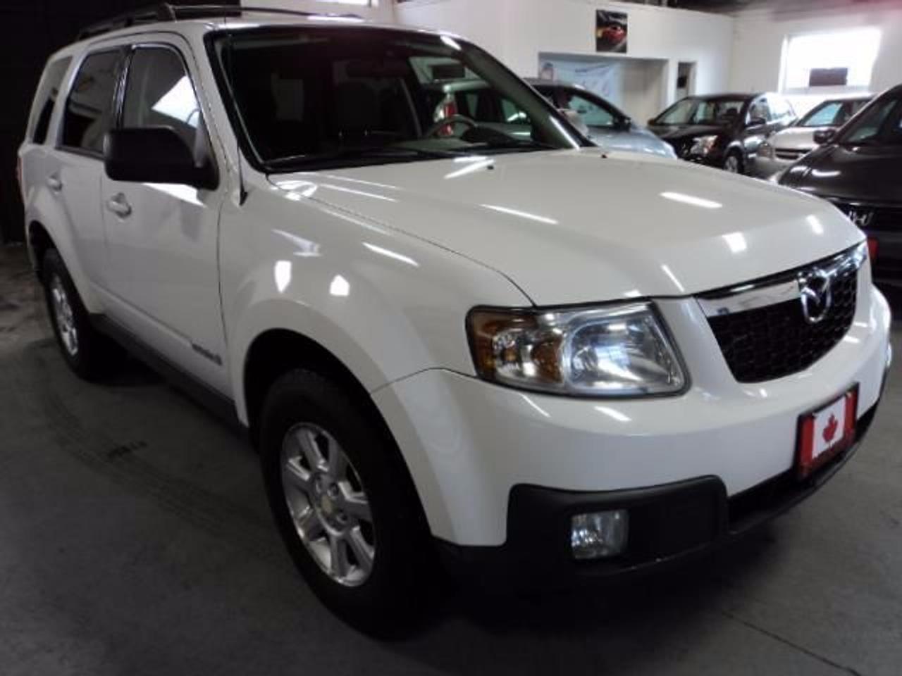 2008 Mazda Tribute - Fully Loaded, Nice and Clean , Fully Certified (Safety and E-Tested) 

Fully loaded with Cloth interior and power options. Like new condition!

Buy In Confidence, Ontario Registered Dealer. 

CarProof Available! 

If you are interested we are here to serve you seven days a week. Do not wait; come on in for a test drive, or call to book an appointment. 

For our contact information, or to view other vehicles from our inventory please see ?Poster Contact Information? on the right side of this page. 

Also regardless of your credit history we can assist you in matching the right financial plan that meets your specific needs. Good Credit/Bad Credit we finance everyone! 

416 Auto Group 

Phone: 416-741-5655 
853 Garyray Drive, Unit 1 
Toronto, Ontario, M9L 1R2 
sales@416autogroup.comConditioning
VEHICLE OPTIONS
Cruise control
Power locks
Power mirrors
Power steering
Power trunk
Remote keyless entry
Tilt wheel
Power windows
Rear window defroster
Rear window wiper
Tinted glass
CD changer
CD player
Premium audio
Satellite radio
Bucket seats
Power seats
Airbag: driver
Airbag: passenger
Alarm
Anti-lock brakes
Fog lights
Traction control
Alloy wheels
Roof rack
Engine: V6 Cylinder Engine 3.0L/181
L/100Km City: 12.5
L/100Km Hwy: 9.1
Mechanical Equipment
16 alloy wheels
3.0L DOHC SMPI 24-valve V6 engine
4-speed automatic transmission w/OD
Active torque split all wheel drive
Battery saver
Electric pwr rack & pinion steering
Engine block heater
Front stabilizer bar
Independent MacPherson strut front suspension w/coil springs
Multi-link rear suspension w/dual lateral links, trailing arms, coil springs
Interior Equipment
60/40 split folding rear seat w/removable seat cushions
Air conditioning
AM/FM audio system w/CD player -inc: (4) speakers, auxiliary input jack
Centre console w/dual cup holders, storage
Cruise control
Custom fitted floor mats
Driver footrest
Engine immobilizer theft-deterrent system
Fixed antenna
Floor console tray
Exterior Equipment
2-speed rear wiper w/washer
2-speed variable intermittent windshield wipers w/washers
Body-colour door handles
Front fog lamps
Front grille w/chrome garnish
Halogen headlights
Liftgate moulding -inc: chrome garnish
Pwr heated mirrors
Roof rails
Solar tint glass -inc: rear door, quarter panel, rear gate glass
Safety Equipment
(3) ceiling mounted child seat tether anchors
3-point seat belts for all seating positions
Childproof rear door locks
Driver & front passenger advanced front airbags
Driver/front passenger side airbags
Front safety belt height adjusters & pretensioners
Front/rear side-impact air curtains
Height adjustable head restraints
Integrated child safety-seat anchor
Rollover stability control