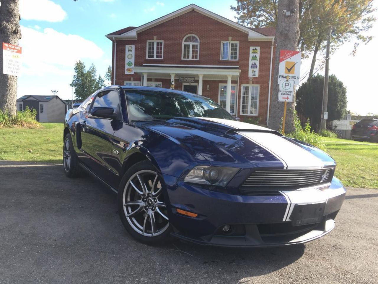 <p>Look at this 5.0 Ford Mustang. Nothing out there like this fully loaded and done up. Full Flowmaster dual exhaust for its muscle sound to have heads turning everywhere you drive. Tuned to push maximum performance and horsepower. Upgraded shifter, Brembo front brakes and Glass top roof for a beauitful touch and view. 6 speed manual transmission, Navigation, Bluetooth, Heated Seats, Satellite radio, Microsoft Sync, USB/AUX hookup but theres more! LED interior lights, with adjustable neon lights in the cup holder, step trim, under the interior and dash lights, HID lights with halo rings. Cruise control, climate control, power windows, locks, seats and mirrors. Factory spoiler with hoodscoop and side scoops. Ford Mustang factory alloy wheels, and almost new tires. Exterior is done in a beautiful dark midnight blue, with black seats and white stitching. There isnt anything like this FIVE-O around! It is a must see and will not last long! Apply today!</p>
<ul>
<li class=li1><span class=s2>Voted <strong><em>#1 Best Used Car Dealership</em></strong> through 2014 - 2016 in London, Ontario</span></li>
<li class=li1><span class=s2>Voted <strong><em>Top Choice Award</em></strong> in 2015 and 2016</span></li>
<li class=li1><span class=s2>Voted <strong><em>London&rsquo;s Readers&rsquo; Choice Award</em></strong> 2014 and 2015&nbsp;</span></li>
<li class=li1><span class=s2><strong><em>A+</em></strong><strong><em>Better Business Bureau rating</em></strong></span></li>
<li class=li1><span class=s2>We have been in business for </span><span class=s4><strong>27yrs</strong></span><span class=s2><strong><em>&nbsp;</em></strong></span></li>
<li class=li1><span class=s2>Most liked used car dealer on social media in Canada</span></li>
<li class=li1><span class=s2>We use an exclusive 3rd party tool that accurately monitors vehicle prices to guarantee our customers get the best value.&nbsp;</span></li>
<li class=li1><span class=s2><strong><em>NO NEED FOR HAGGLING!&nbsp;</em></strong></span></li>
<li class=li1><span class=s2><strong><em>NO HIDDEN ADMIN. FEES!</em></strong></span></li>
<li class=li1><span class=s2><strong><em>Just honesty and integrity at no additional charge</em></strong></span></li>
<li class=li1><span class=s2>All vehicles:</span></li>
<ul>
<li class=li1><span class=s2>Go through Safety inspection with 30 days 100% safety related items warranty completed by us</span></li>
<li class=li1><span class=s2>With below 50% brakes will be replaced&nbsp;</span></li>
<li class=li1><span class=s2>Receive a semi-synthetic oil-lube-filter</span></li>
<li class=li1><span class=s2>Undergo Emissions test and an extensive inspection</span></li>
<li class=li1><span class=s2>Include a FREE CarProof Report</span></li>
<li class=li2><span class=s2>Purchased include FREE cleanup and detailing</span></li>
</ul>
<li class=li2><span class=s2>Our <em>Finance Specialists</em> will do their best to:</span></li>
<ul>
<li class=li2><span class=s2>Provide <strong><em>SAME-DAY APPROVALS</em></strong></span></li>
<li class=li2><span class=s2>Ensure achieving the <strong><em>LOWEST INTEREST RATE &</em></strong> <strong><em>BEST TERMS </em></strong>possible</span></li>
<li class=li2><span class=s2>Provide <strong><em>FULLY OPEN-END LOANS *pay them off any time with no penalty*</em></strong></span></li>
</ul>
<li class=li3><span class=s2>Whether its good, bad or no credit, bankruptcy, proposal, divorce or repossessions. $0 down Apply securely with confidence at <a href=http://bit.ly/2cg4WeM><span class=s5>http://bit.ly/2cg4WeM</span></a></span><span class=s6>&nbsp;</span></li>
<li class=li3><span class=s2>We make the buying process SIMPLE and STRESS-FREE, our reviews speak for themselves:</span></li>
<ul>
<li class=li4><span class=s8><strong><em>Google</em></strong><em>:</em></span><span class=s9><a href=http://bit.ly/2cK4fi3><span class=s10>http://bit.ly/2cK4fi3</span></a></span></li>
<li class=li5><span class=s8><strong><em>DealerRater:</em></strong></span><span class=s12><a href=http://bit.ly/2cIdFI1><span class=s5>http://bit.ly/2cIdFI1</span></a></span></li>
<li class=li5><span class=s8><strong><em>N49.com:</em></strong></span><span class=s12><a href=http://bit.ly/2bYZlOh><span class=s5>http://bit.ly/2bYZlOh</span></a></span></li>
<li class=li5><span class=s8><strong><em>BBB:</em></strong></span><span class=s9> <a href=http://go.bbb.org/2cK5Cxd><span class=s5>http://go.bbb.org/2cK5Cxd</span></a></span></li>
</ul>
</ul>
<p>&nbsp;</p>
<p class=p6><span class=s2>**Payments are based off qualifying monthly term $0 down & 4.9% interest. Qualifying term and rate of borrowing varies by lender. Example: The cost of borrowing on a vehicle with a purchase price of $10000 at 4.9% over 60 month term is $1499.78. Rates are subject to change without notice.&nbsp;</span></p>
<p>&nbsp;</p>