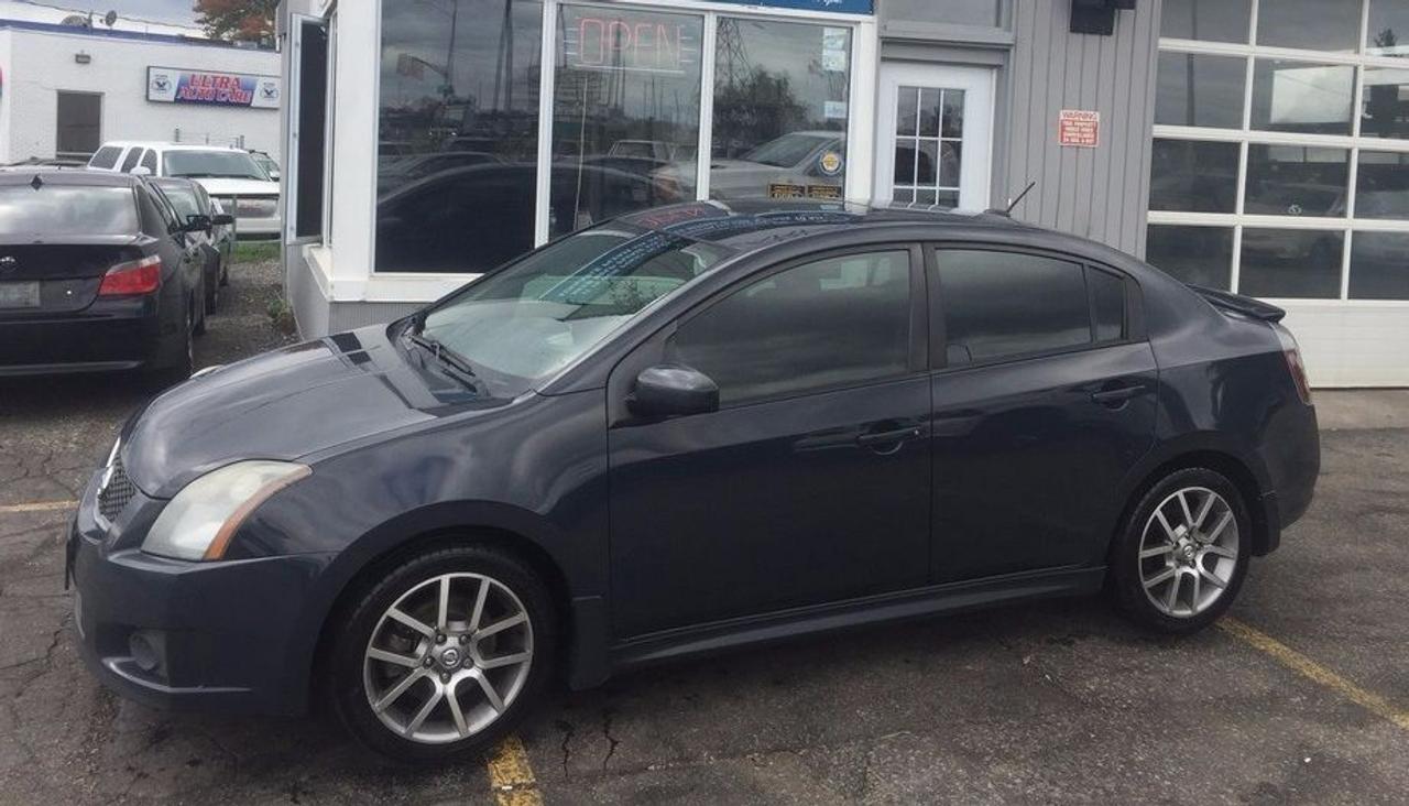Sentra SER just arrived! Black with red stitching interior, pillar gauges, sunroof, all power options and the upgraded 177hp motor! Dont miss out on this rare car. Contact our sales staff now 519-652-5652
