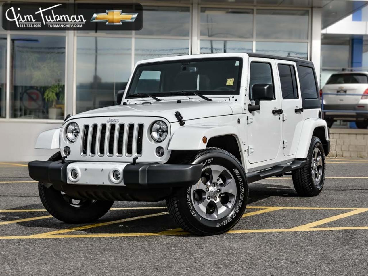 Introducing an incredible rare find  this impressive 2016 Jeep Wrangler Unlimited Sahara is sure to meet all of your needs as you cruise through the roads of Ottawa with style and power. Save big on this former daily rental  Jim Tubman Chevrolet offers simple selling  simple pricing  which means no more expensive dealer fees.