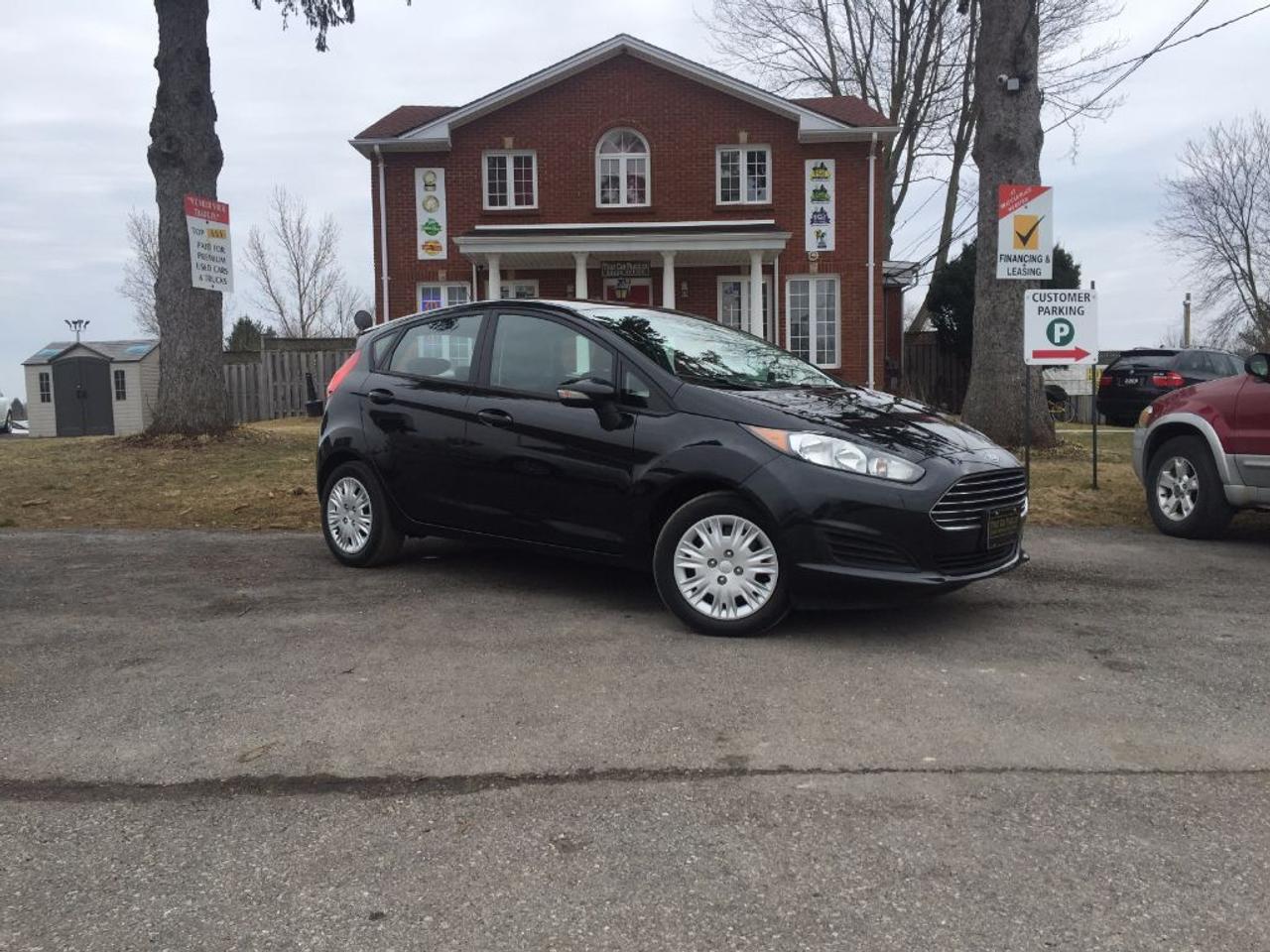 <p>This 2014 Ford Fiesta SE hatchback is nicely equipped and one fuel efficient car. Comes with BLUETOOTH, CARGO SHADE, AUX connectivity for your IPOD/IPHONE or ANDROID music playing device and more. Call 1-519-686-7253 or Visit 443 Exeter Rd. That Car Place.</p>
<ul>
<li class=li1><span class=s2>Voted&nbsp;<strong><em>#1 Best Used Car Dealership</em></strong>&nbsp;through 2014 - 2017 (4 yrs) in London, Ontario</span></li>
<li class=li1><span class=s2>Voted&nbsp;<strong><em>Top Choice Award</em></strong>&nbsp;in 2015 - 2017 (3 yrs)</span></li>
<li class=li1><span class=s2>Voted&nbsp;<strong><em>London&rsquo;s Readers&rsquo; Choice Award</em></strong>&nbsp;2014 and 2015&nbsp;</span></li>
<li class=li1><span class=s2><strong><em>A+</em></strong><strong><em>Better Business Bureau rating</em></strong></span></li>
<li class=li1><span class=s2>We have been in business for&nbsp;</span><span class=s4><strong>27yrs</strong></span><span class=s2><strong><em>&nbsp;</em></strong></span></li>
<li class=li1><span class=s2>Most liked used car dealer on social media in Canada</span></li>
<li class=li1><span class=s2>We use an exclusive 3rd party tool that accurately monitors vehicle prices to guarantee our customers get the best value.&nbsp;</span></li>
<li class=li1><span class=s2><strong><em>NO NEED FOR HAGGLING!&nbsp;</em></strong></span></li>
<li class=li1><span class=s2><strong><em>NO HIDDEN ADMIN. FEES!</em></strong></span></li>
<li class=li1><span class=s2><strong><em>Just honesty and integrity at no additional charge</em></strong></span></li>
<li class=li1><span class=s2>All vehicles:</span></li>
<ul>
<li class=li1><span class=s2>Go through Safety inspection with 30 days 100% safety related items warranty completed by us</span></li>
<li class=li1><span class=s2>With below 50% brakes will be replaced&nbsp;</span></li>
<li class=li1><span class=s2>Receive a semi-synthetic oil-lube-filter</span></li>
<li class=li1><span class=s2>Undergo Emissions test and an extensive inspection</span></li>
<li class=li1><span class=s2>Include a FREE CarProof Report</span></li>
<li class=li2><span class=s2>Purchased include FREE cleanup and detailing</span></li>
</ul>
<li class=li2><span class=s2>Our&nbsp;<em>Finance Specialists</em>&nbsp;will do their best to:</span></li>
<ul>
<li class=li2><span class=s2>Provide&nbsp;<strong><em>SAME-DAY APPROVALS</em></strong></span></li>
<li class=li2><span class=s2>Ensure achieving the&nbsp;<strong><em>LOWEST INTEREST RATE &</em></strong>&nbsp;<strong><em>BEST TERMS&nbsp;</em></strong>possible</span></li>
<li class=li2><span class=s2>Provide&nbsp;<strong><em>FULLY OPEN-END LOANS *pay them off any time with no penalty*</em></strong></span></li>
</ul>
<li class=li3><span class=s2>Whether its good, bad or no credit, bankruptcy, proposal, divorce or repossessions. $0 down Apply securely with confidence at&nbsp;<a href=http://bit.ly/2cg4WeM><span class=s5>http://bit.ly/2cg4WeM</span></a></span><span class=s6>&nbsp;</span></li>
<li class=li3><span class=s2>We make the buying process SIMPLE and STRESS-FREE, our reviews speak for themselves:</span></li>
<ul>
<li class=li4><span class=s8><strong><em>Google</em></strong><em>:</em></span><span class=s9><a href=http://bit.ly/2cK4fi3><span class=s10>http://bit.ly/2cK4fi3</span></a></span></li>
<li class=li5><span class=s8><strong><em>DealerRater:</em></strong></span><span class=s12><span class=s5><a href=http://bit.ly/2cIdFI1>http://bit.ly/2cIdFI1</a></span></span></li>
<li class=li5><em><strong>Reviewsii:</strong></em><a style=text-indent: -18pt; href=http://bit.ly/2ot45Ar>http://bit.ly/2ot45Ar</a><span style=text-indent: -18pt;>&nbsp;&nbsp;</span></li>
<li class=li5><span class=s8><strong><em>BBB:</em></strong></span><span class=s9>&nbsp;<a href=http://go.bbb.org/2cK5Cxd><span class=s5>http://go.bbb.org/2cK5Cxd</span></a></span></li>
</ul>
</ul>
<p>&nbsp;**Payments are based off qualifying monthly term $0 down & 4.9% interest. Qualifying term and rate of borrowing varies by lender. Example: The cost of borrowing on a vehicle with a purchase price of $10000 at 4.9% over 60 month term is $1499.78. Rates are subject to change without notice.&nbsp;</p>